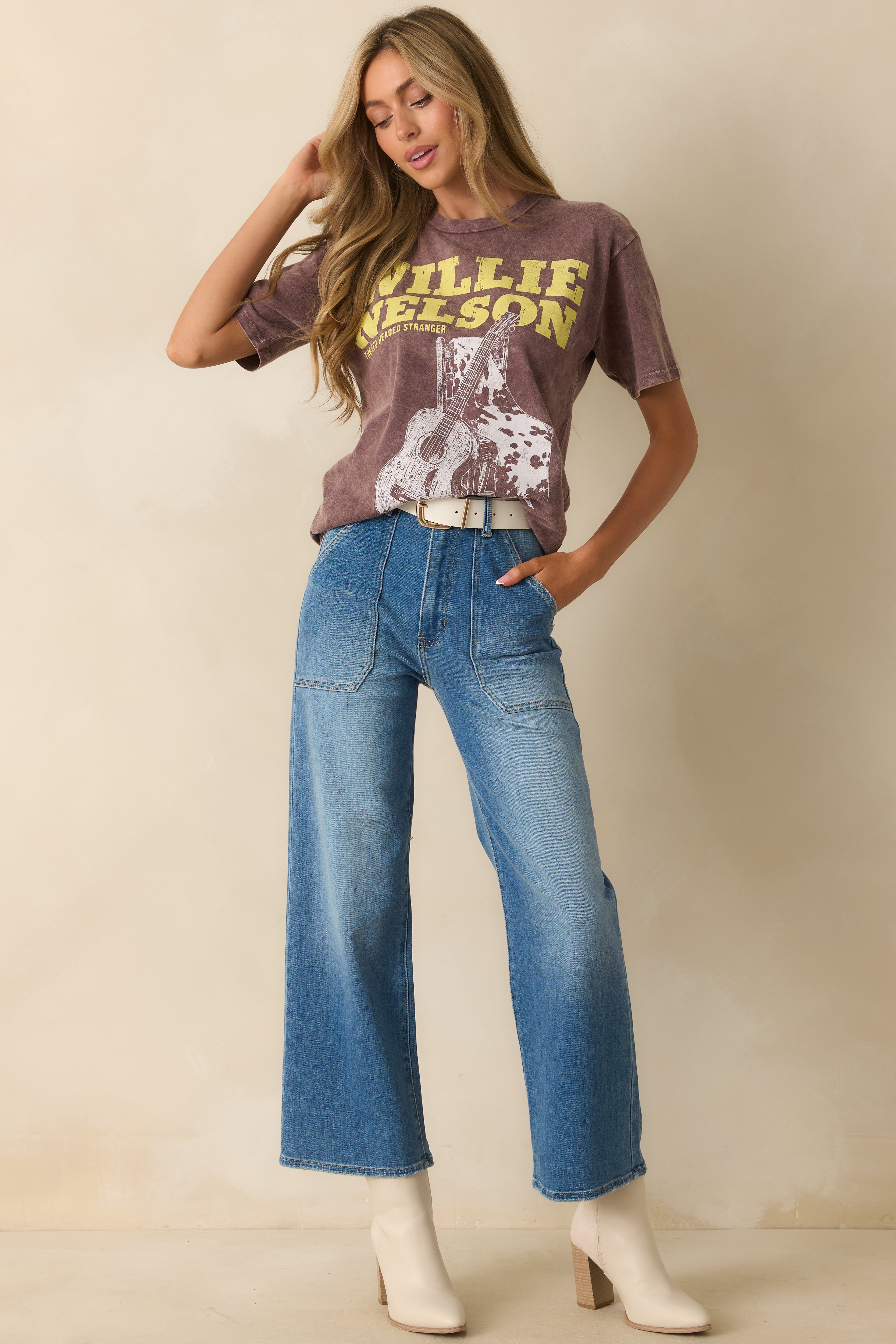 Front view of the brown short-sleeve graphic tee showing the relaxed fit and crew neckline.