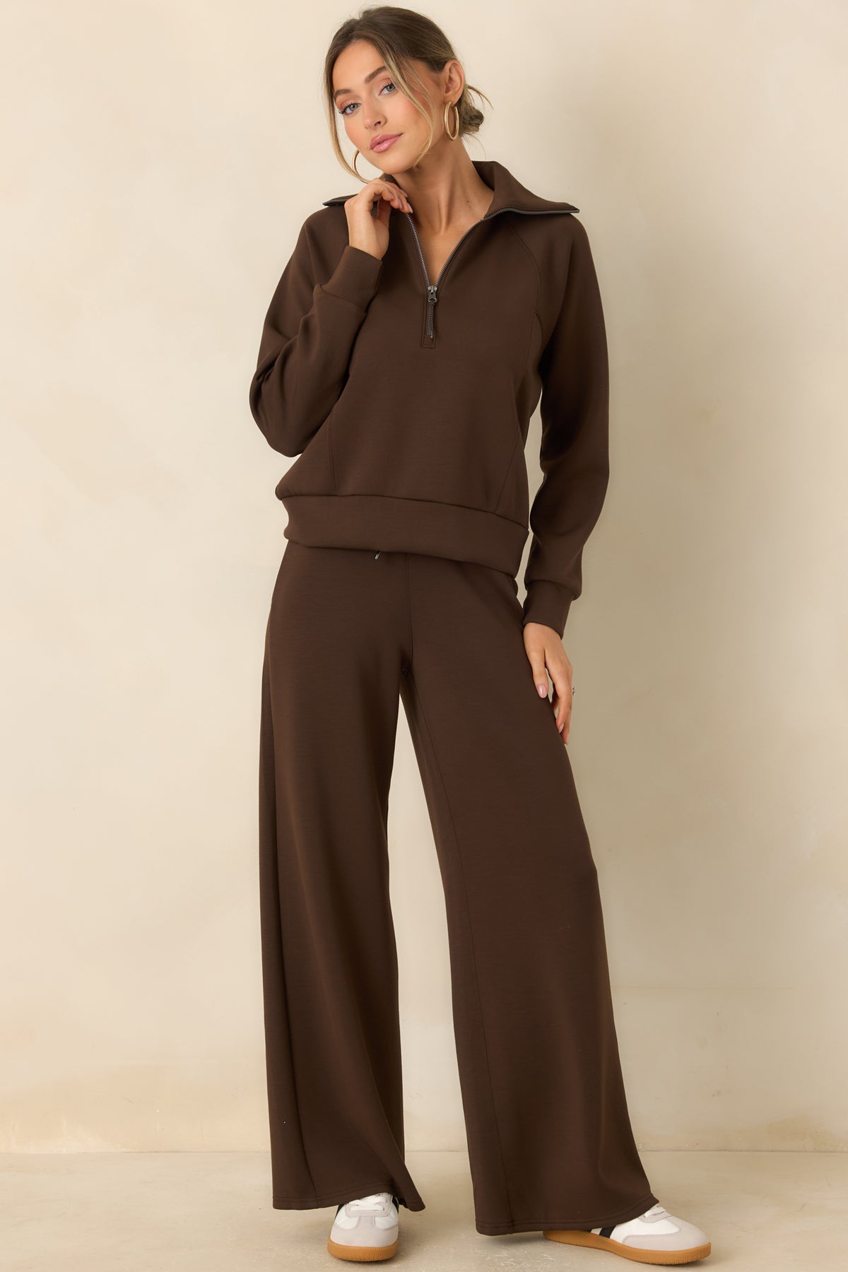 Lightweight brown pants with four-way stretch, clean seams, and relaxed legs that drape naturally.