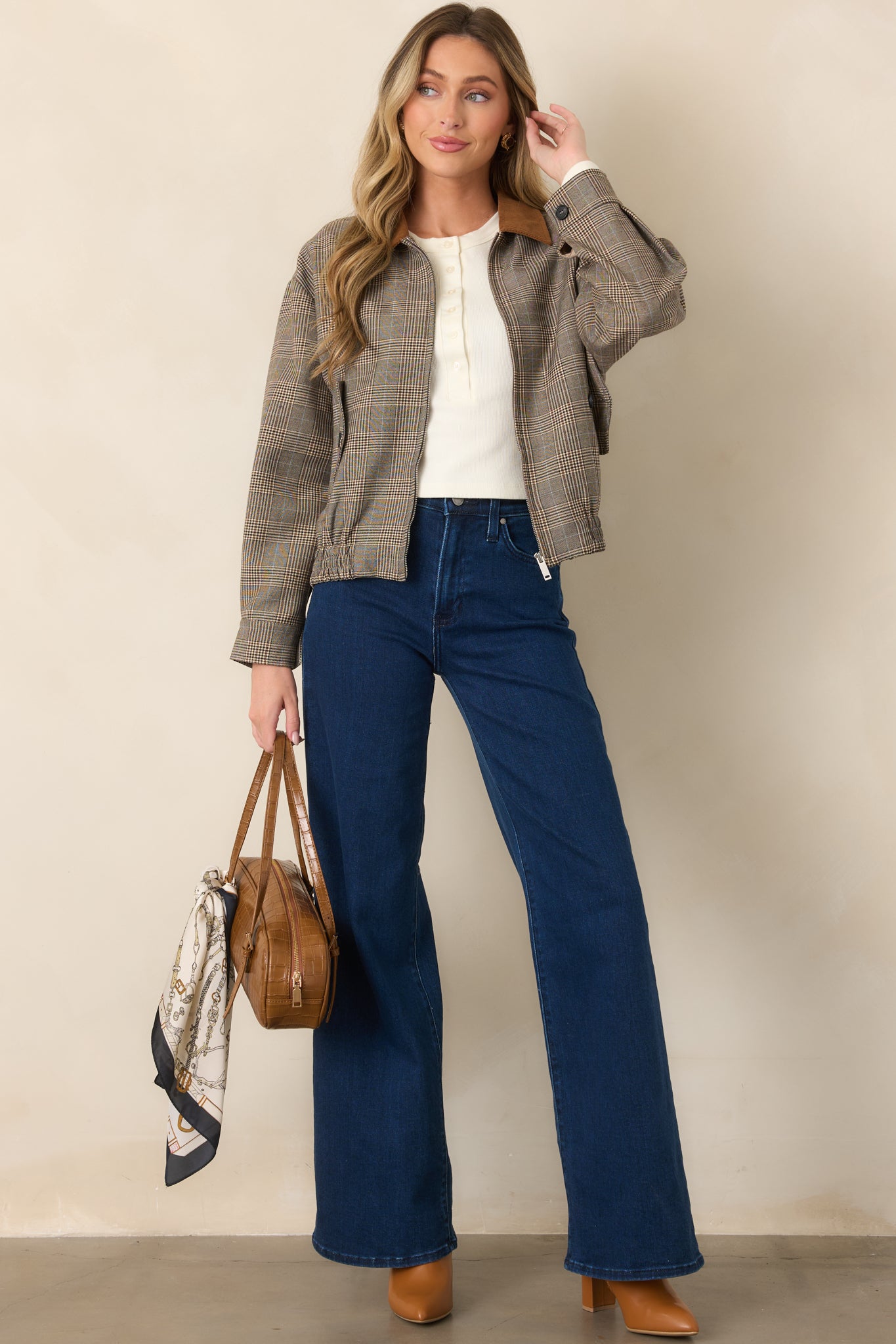 Woven brown plaid jacket with a softly structured bomber silhouette, contrasting corduroy collar, functional flap pockets, and gathered hem.