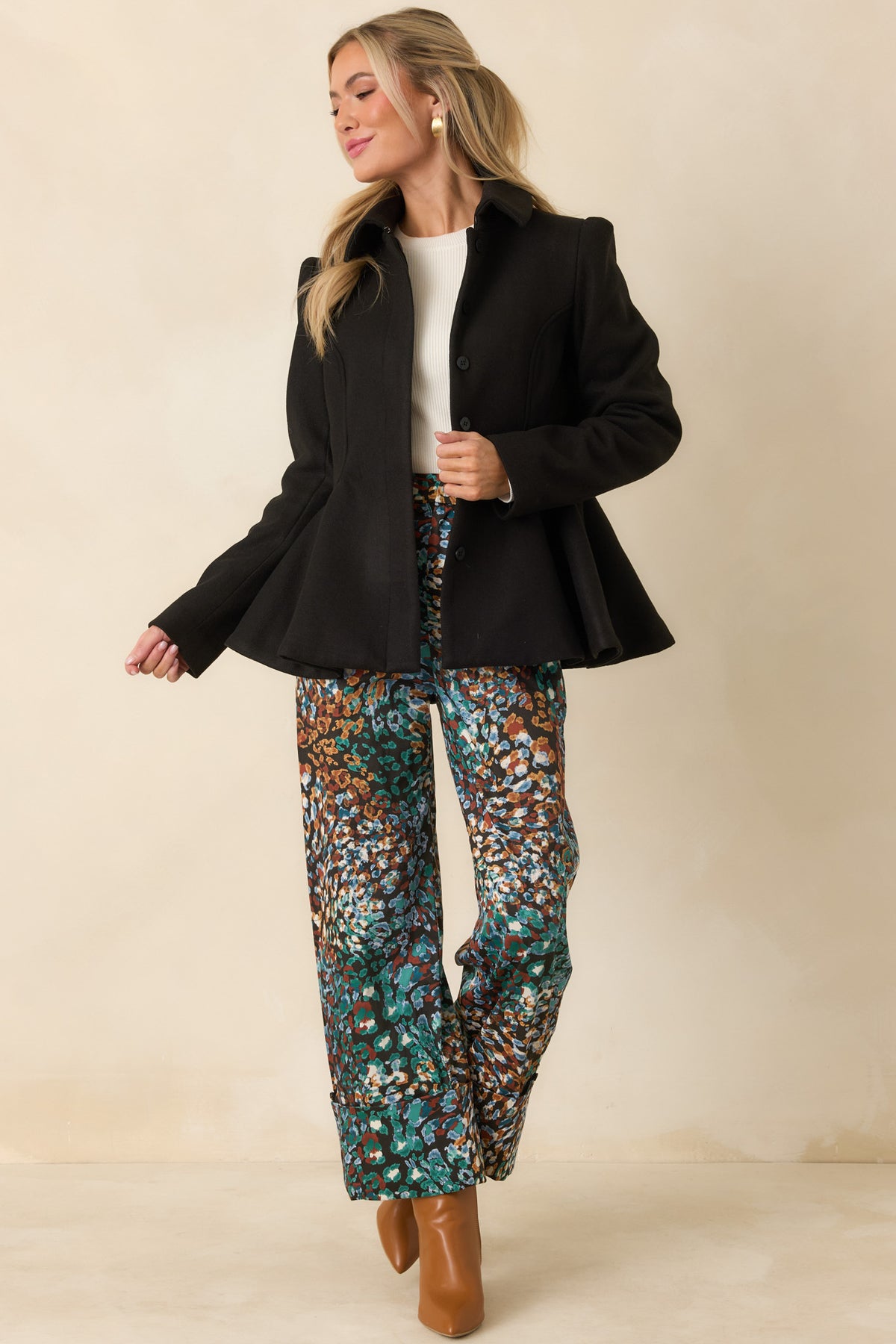 Brushed felt jacket with a pointed collar, fitted waist, and sculptural peplum hem.