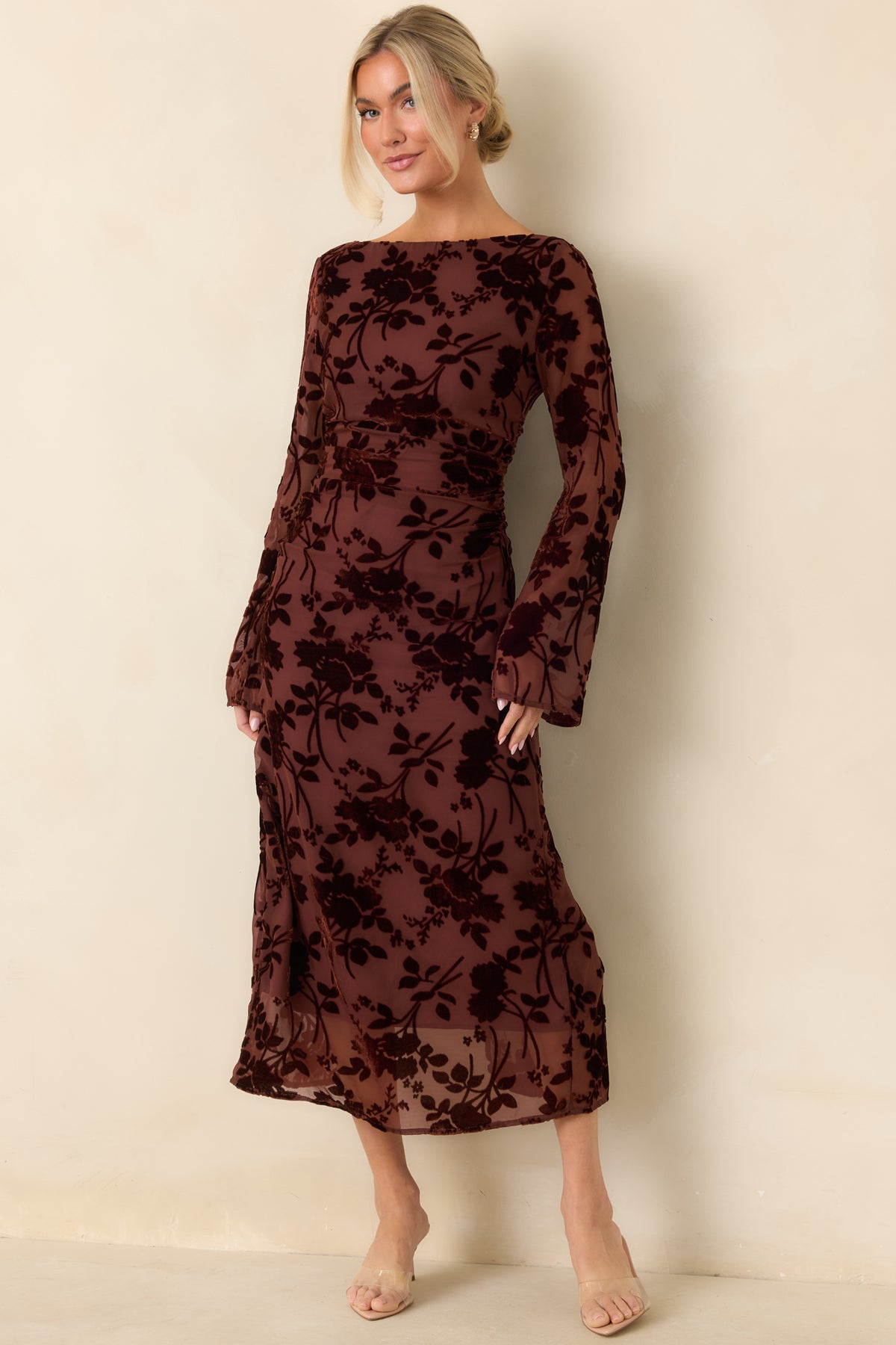 Burgundy burnout velvet midi dress with a slim shape, ruched waist, and sheer mesh accents throughout.