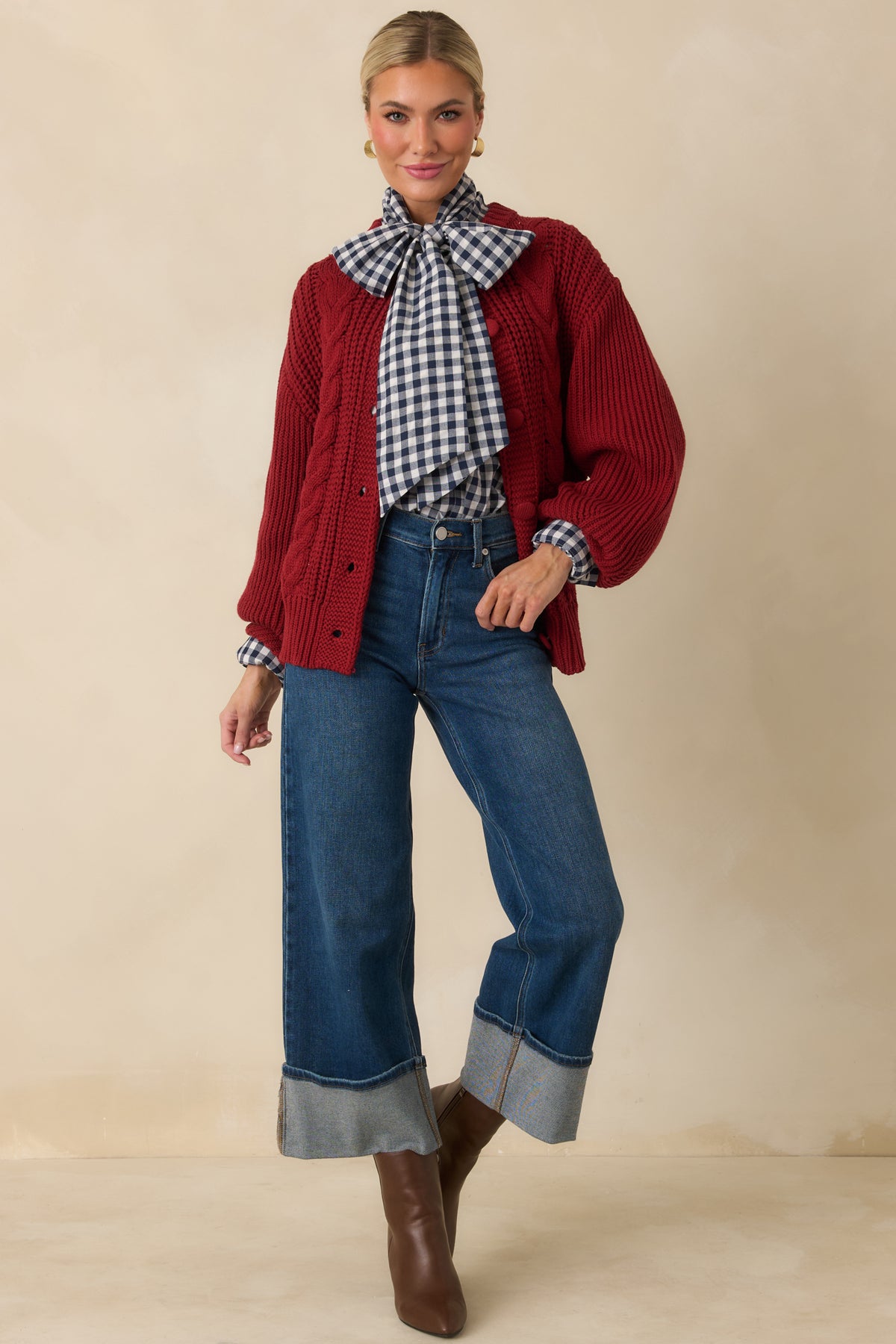 Burgundy cardigan featuring dropped shoulders, long voluminous sleeves, and a softly structured ribbed hem.