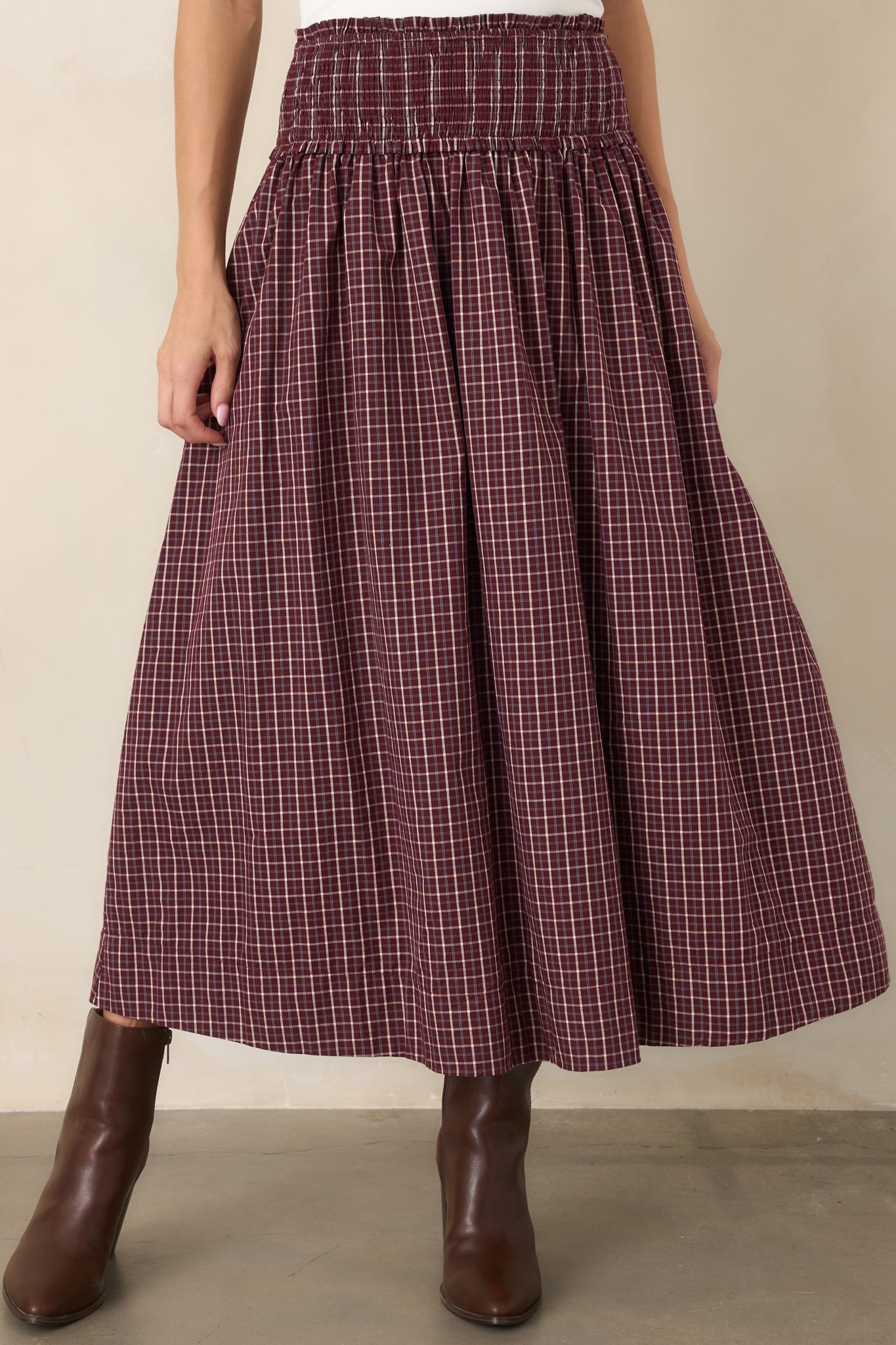 Burgundy, ivory, and light blue plaid skirt showcasing the gathered cotton fabric and full flowing shape.