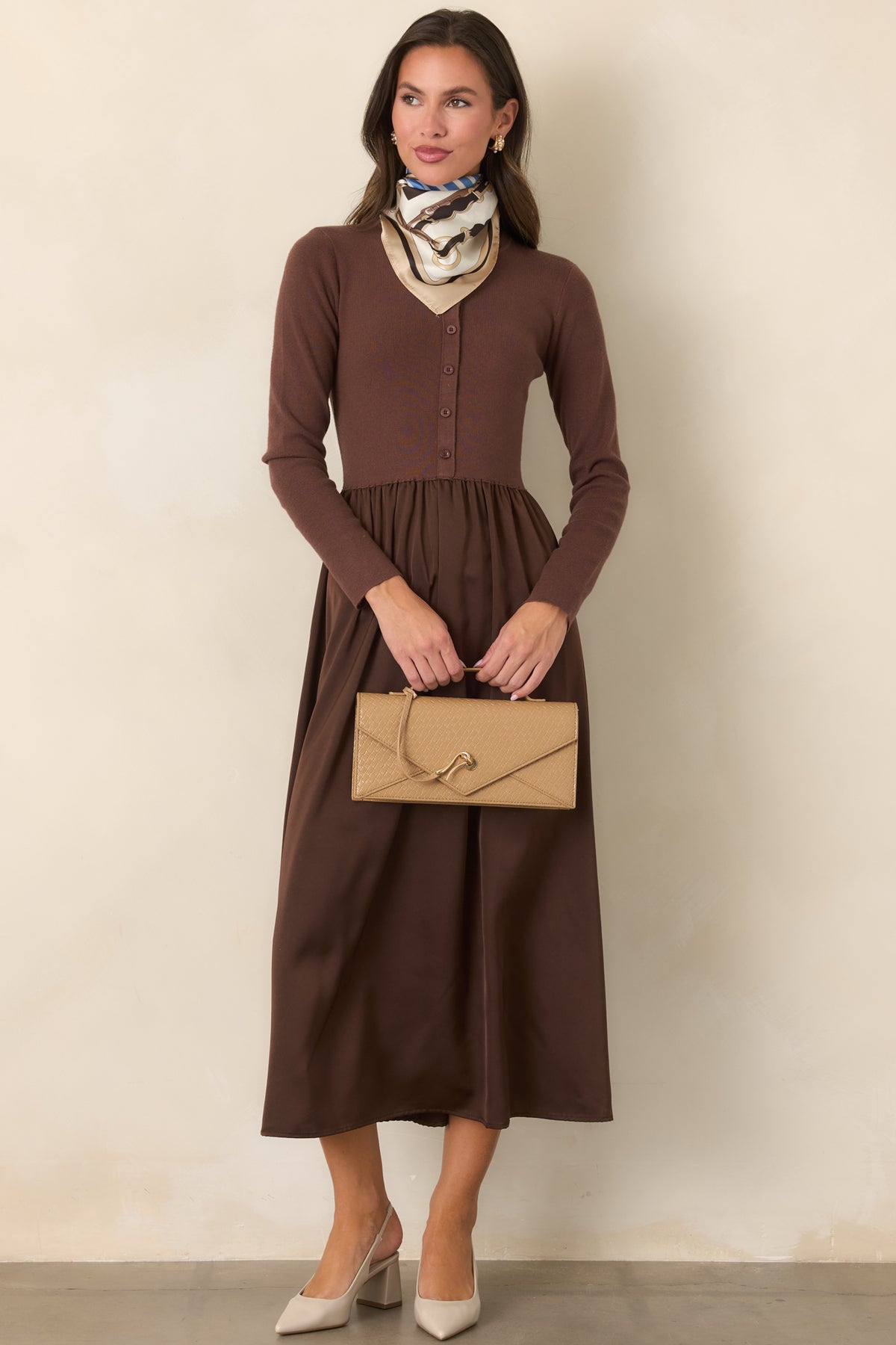 Burgundy midi dress with a cardigan-style knit bodice, round neckline, long sleeves, and tonal buttons.