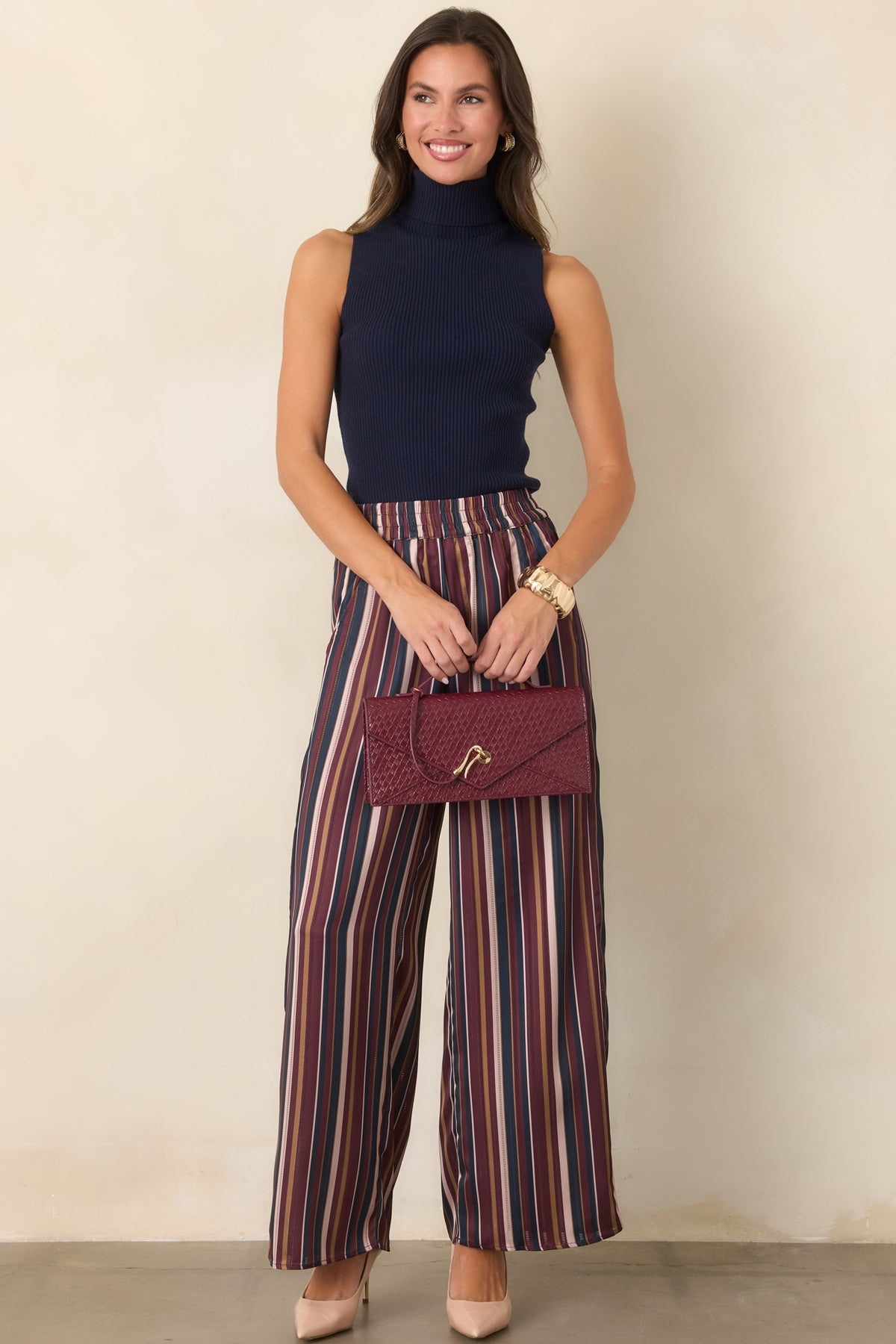 Burgundy, navy, champagne, and olive striped pants with a smooth satin finish.