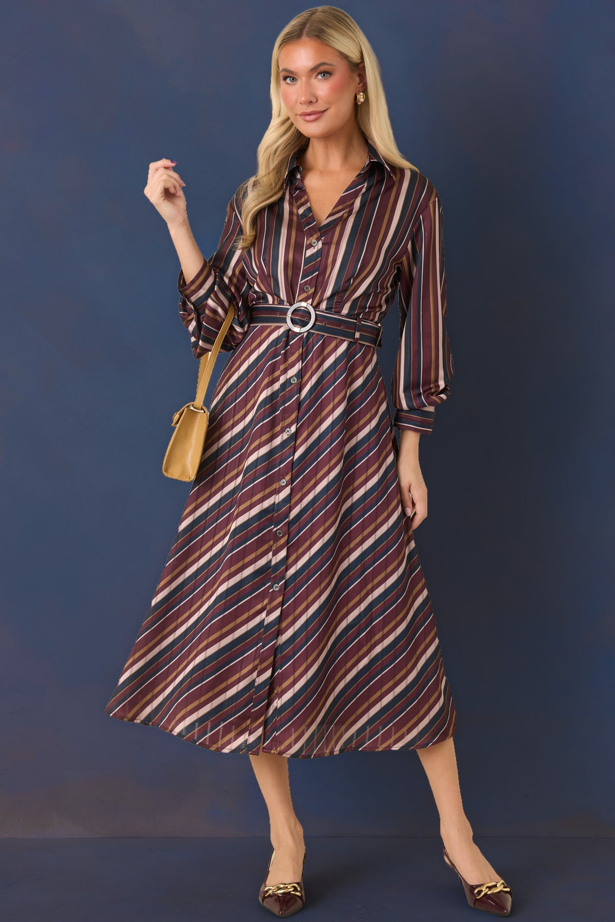 Satin dress featuring vertical burgundy, navy, champagne, and olive stripes through the bodice.