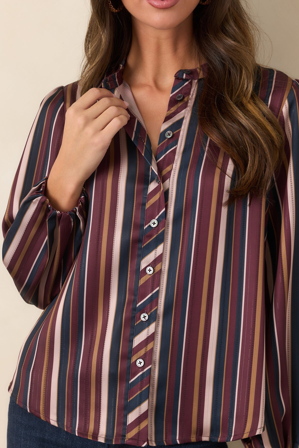 Smooth satin top featuring burgundy, navy, champagne, and olive stripes with a contrasting diagonal stripe detail along the button placket and band collar.