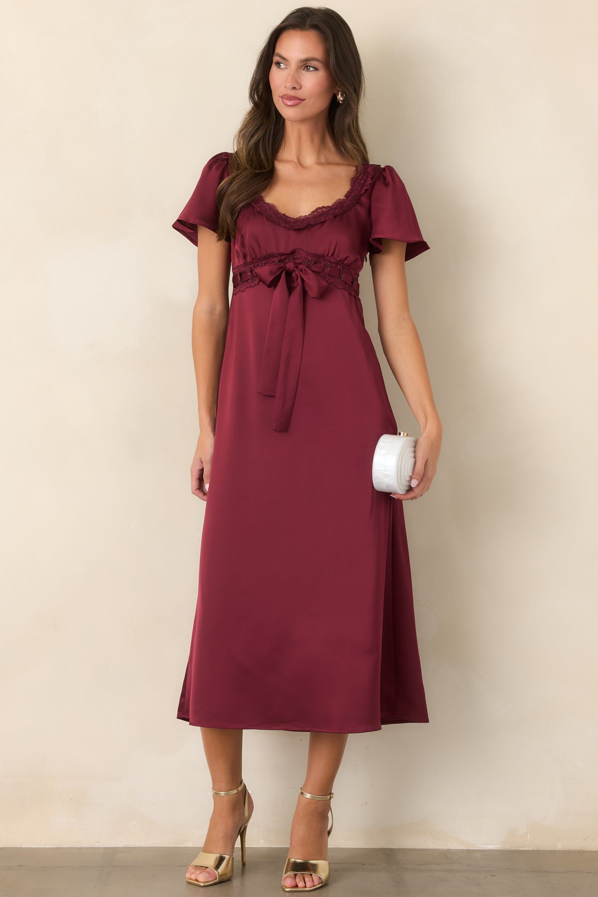 Rich burgundy satin midi dress with scalloped lace detailing along the empire waist and scoop neckline.