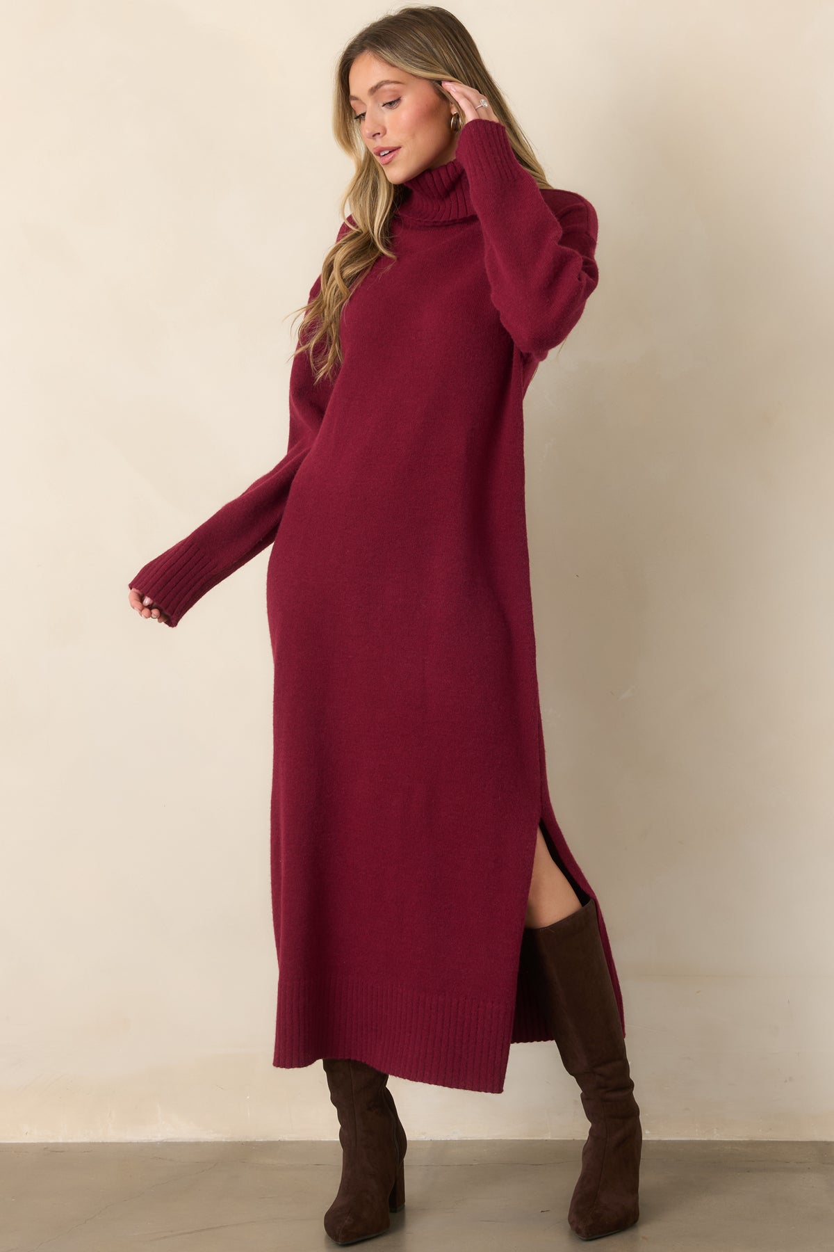 Burgundy sweater midi dress showcasing its soft stretch knit texture, streamlined silhouette, cozy turtleneck, long sleeves, and ribbed hem.