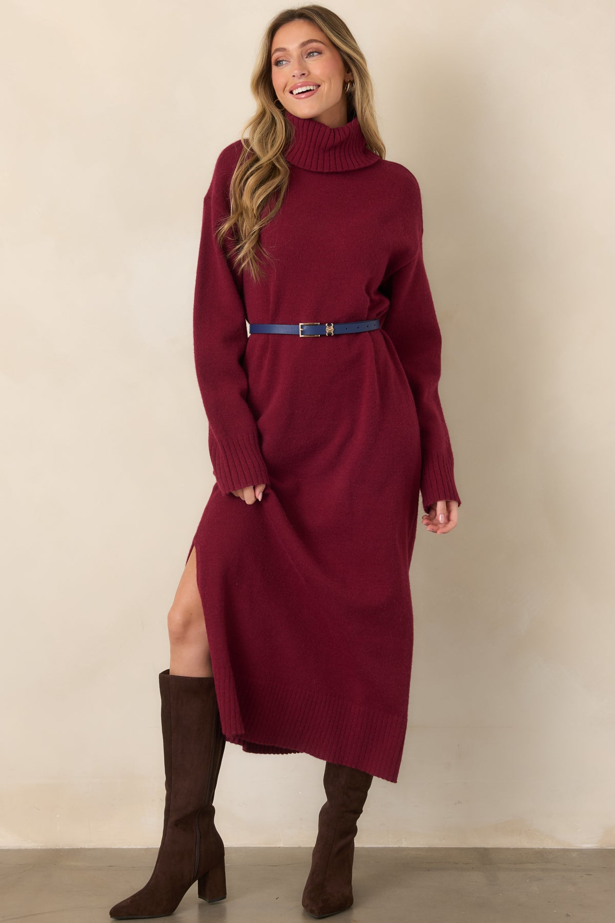 Rich burgundy midi sweater dress highlighting its classic turtleneck, comfortable knit texture, long sleeves, and gently streamlined silhouette.