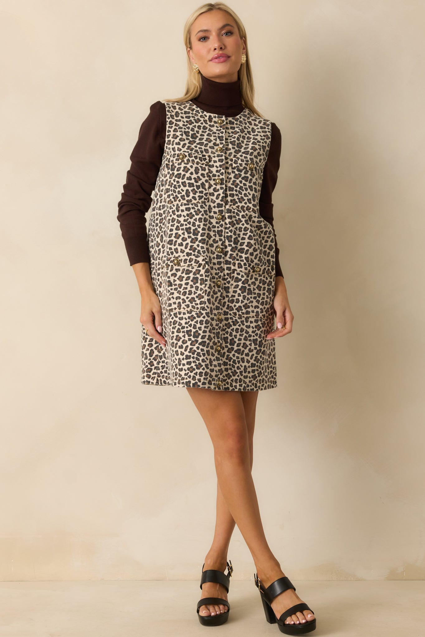 Button-front leopard print denim dress highlighting its casual yet polished look.