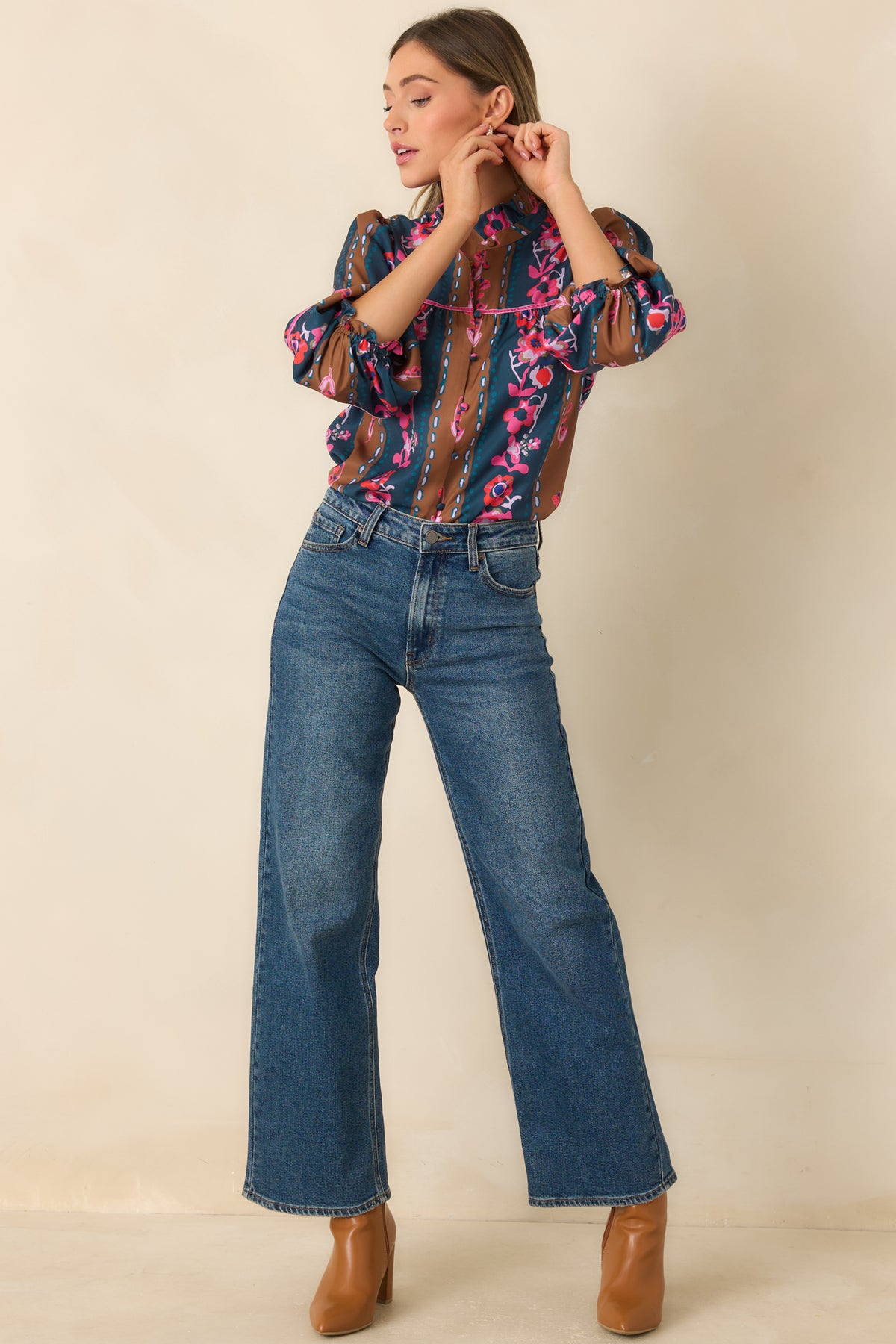 CROSBY blouse with a relaxed gathered silhouette, colorful tapestry stripes, and elasticized ruffle cuffs.