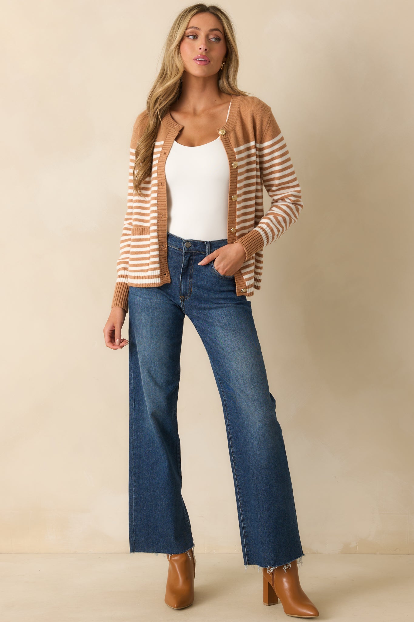 Camel brown cardigan with ivory stripe pattern, crew neckline, long sleeves, and relaxed fit.