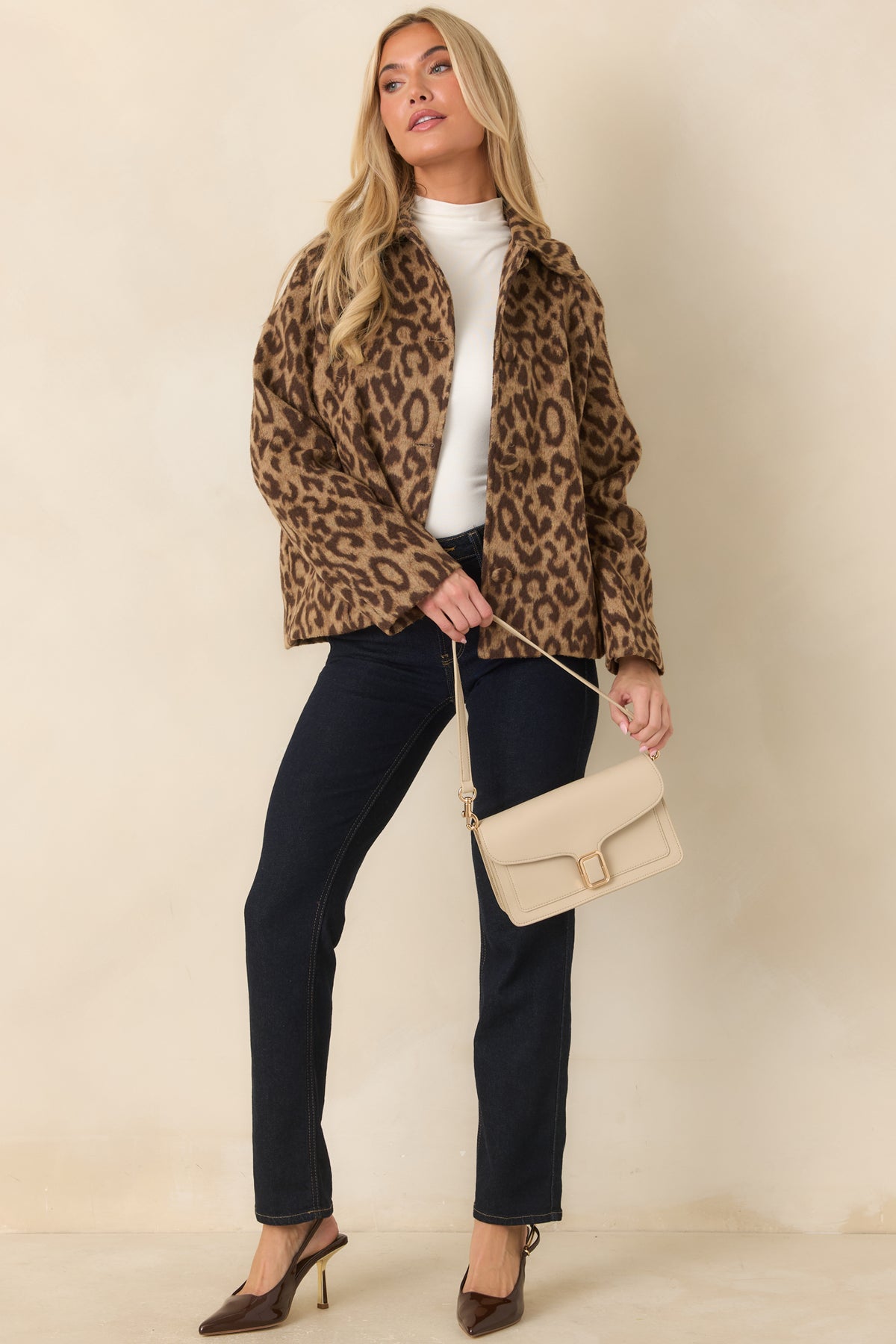 Camel and dark brown leopard jacket with a boxy shape, long sleeves, and a classic buttoned front.