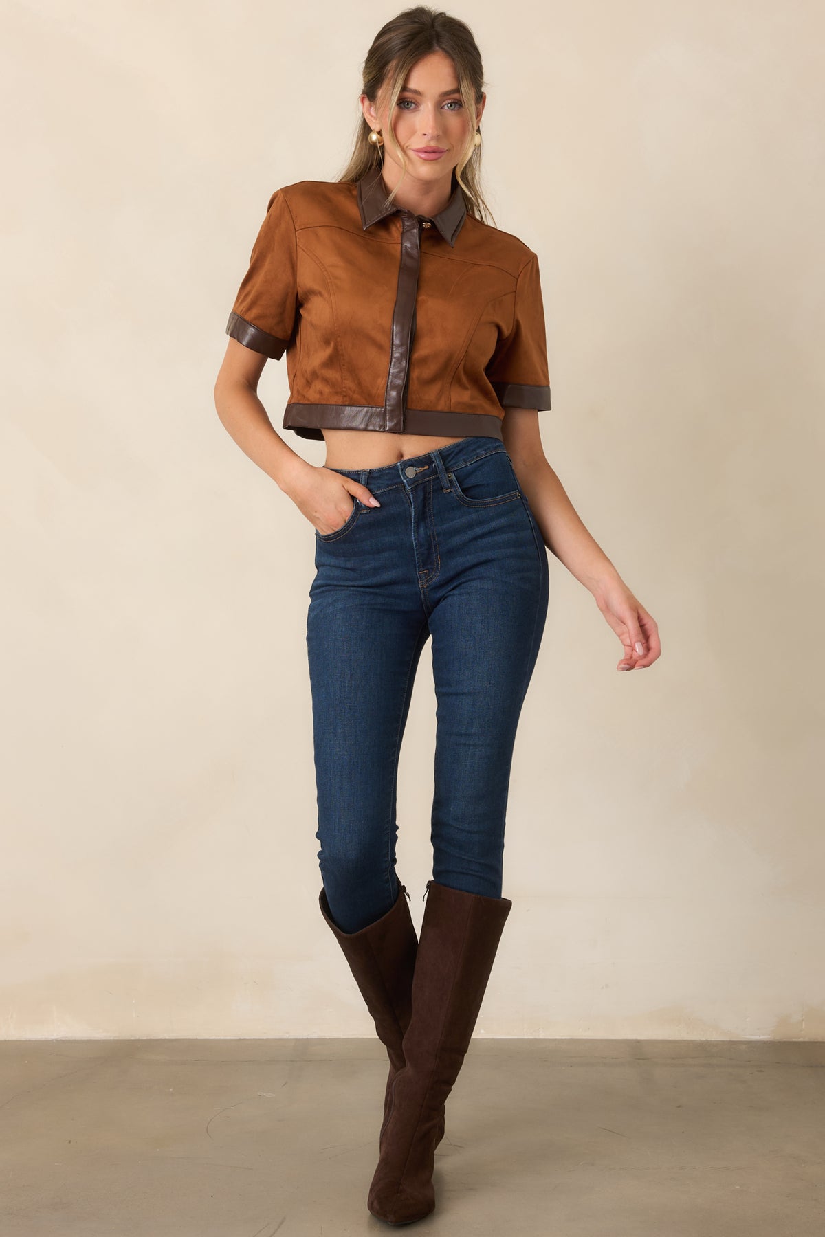 Cropped camel faux suede top with chocolate brown trim along the front placket, sleeves, and hem.