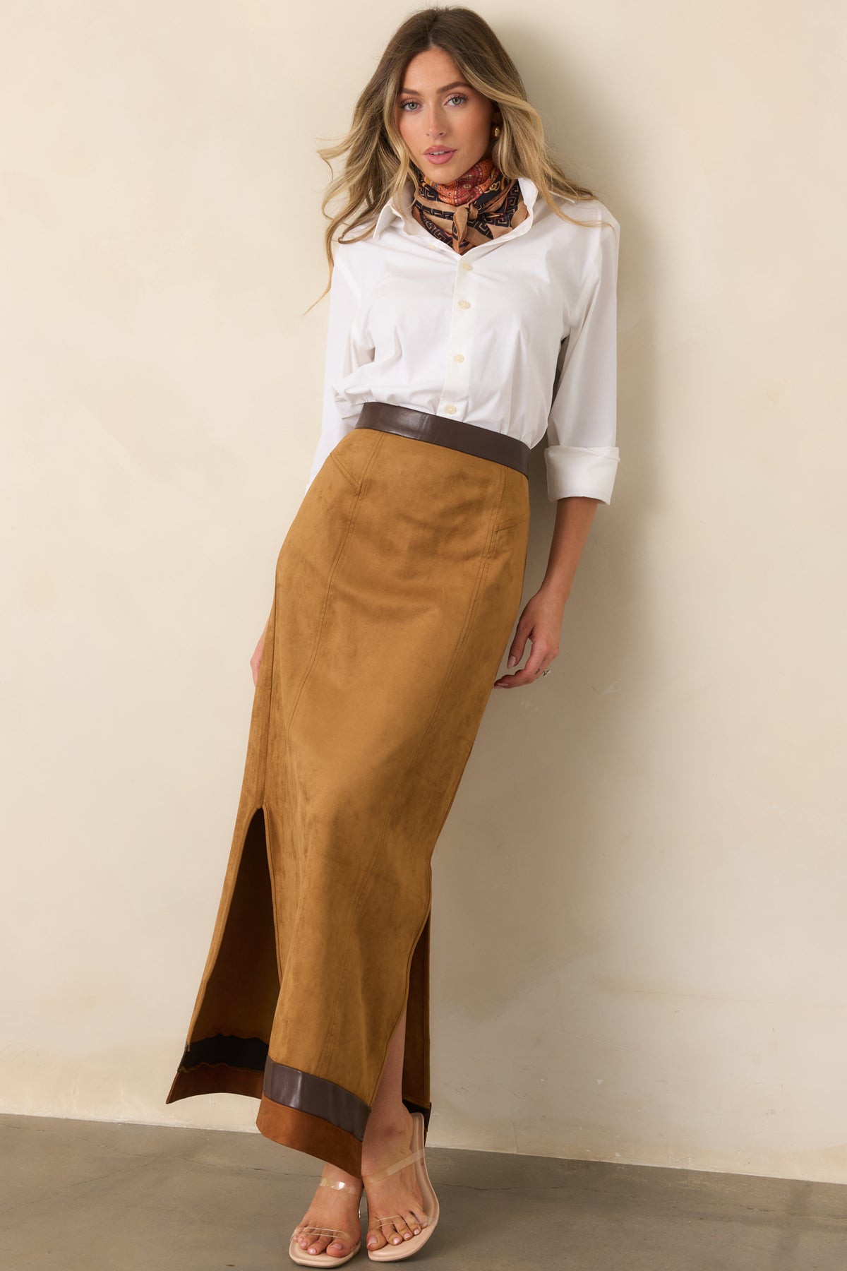 Warm camel faux suede maxi skirt with chocolate brown contrast trim and a long, straight silhouette.