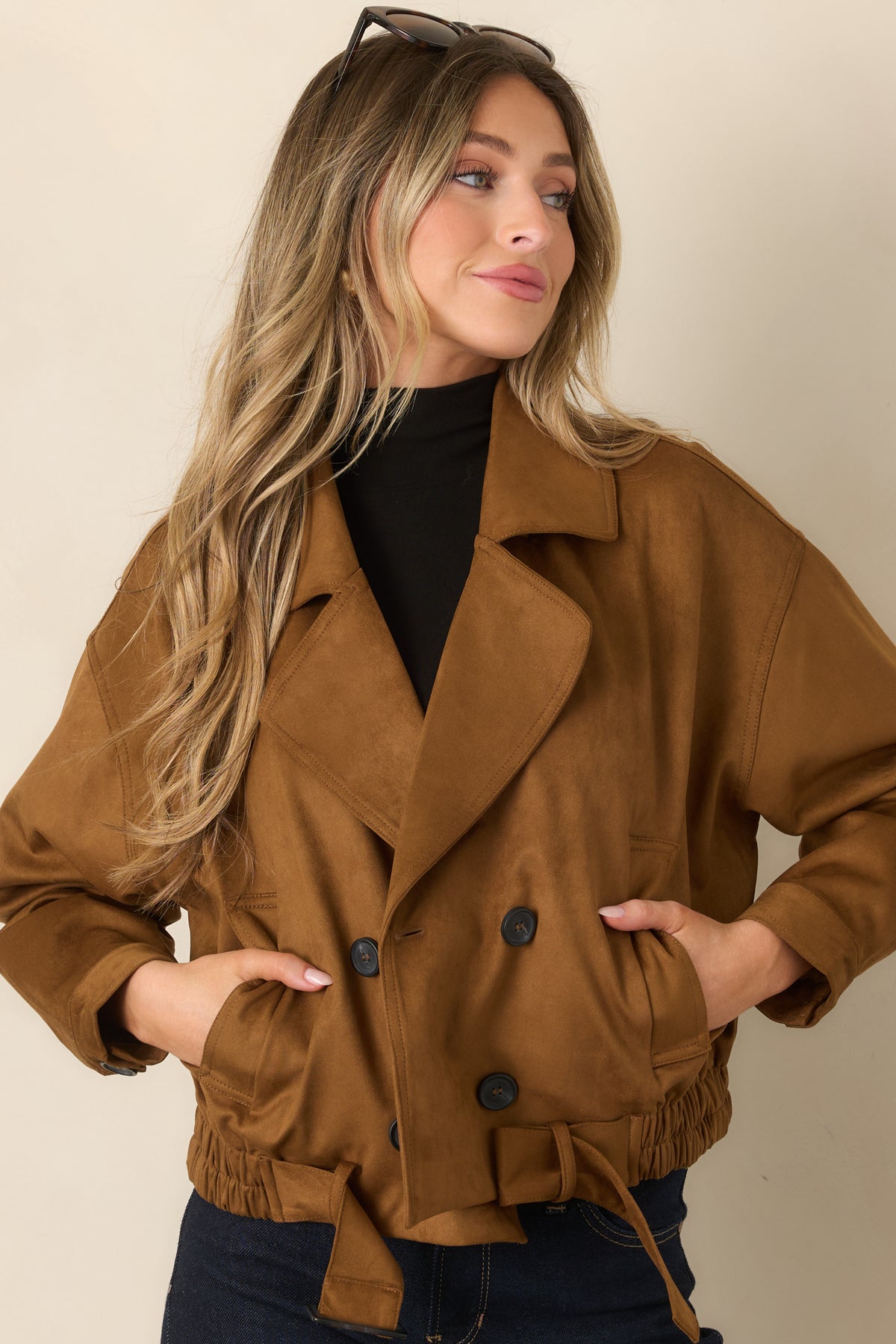 Camel faux suede coat featuring button closures and functional front pockets.