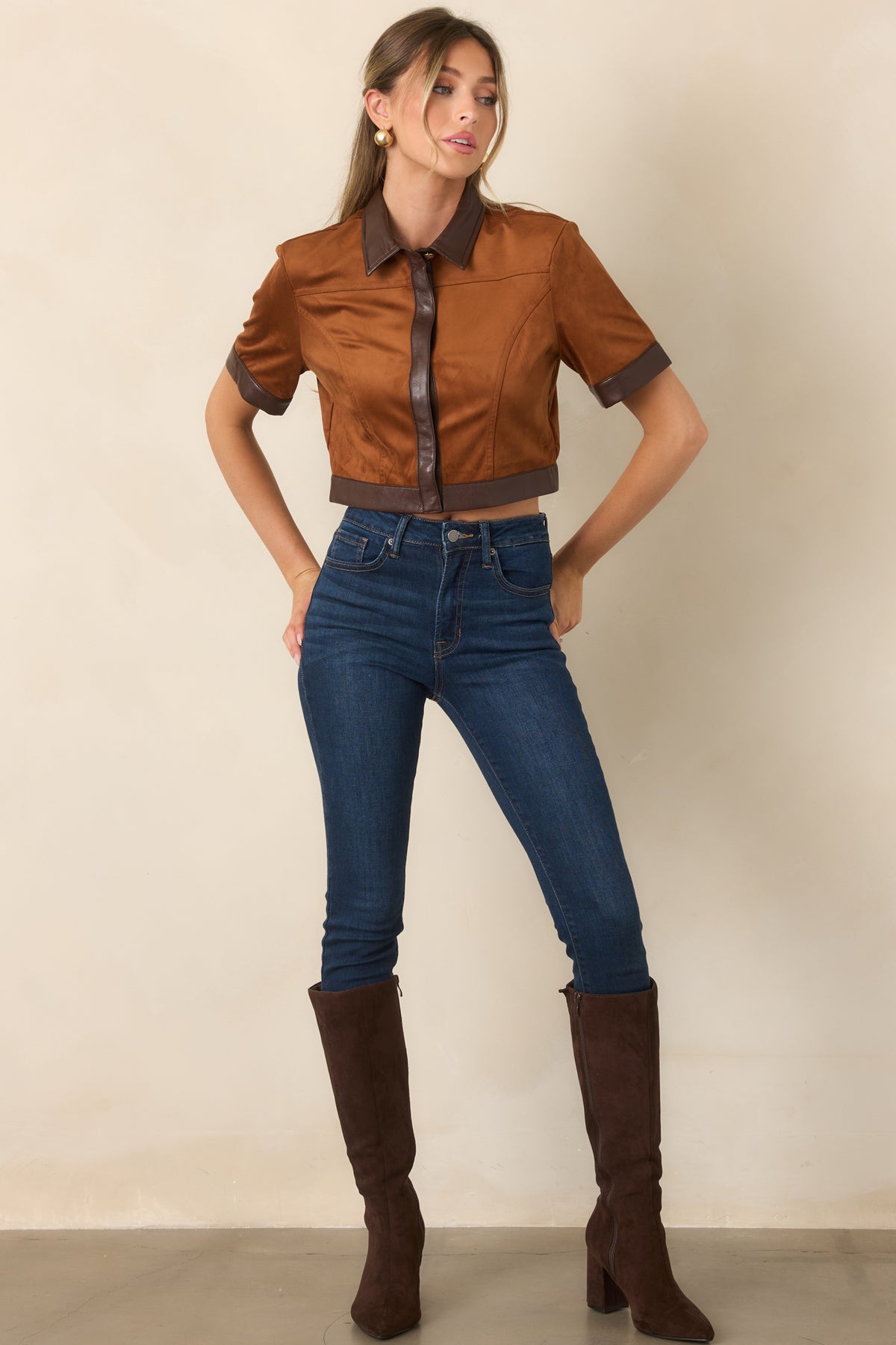 Camel faux suede cropped top showcasing its structured silhouette and contrasting chocolate brown faux leather trim.