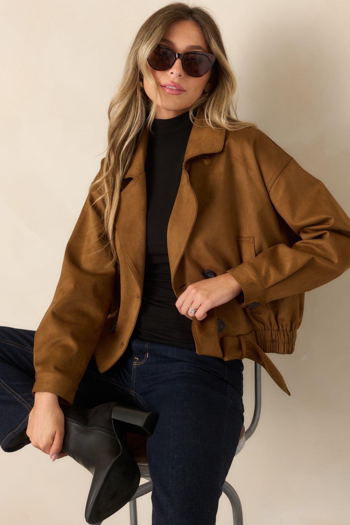Camel faux suede coat with a wide lapel collar, belted waist, and elasticized hem.