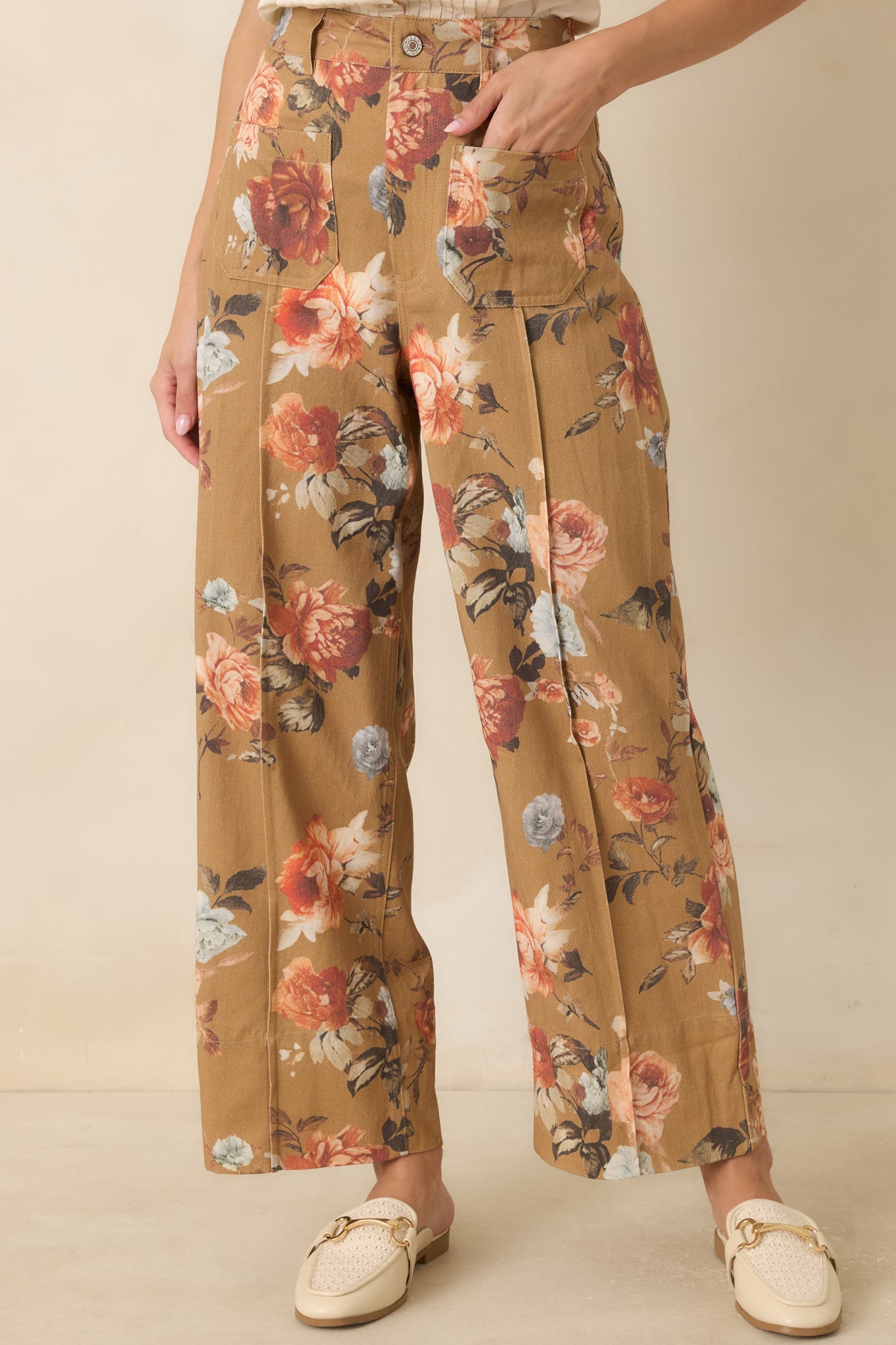 Detailed view of the camel floral fabric showcasing the vintage-inspired print and woven cotton texture.