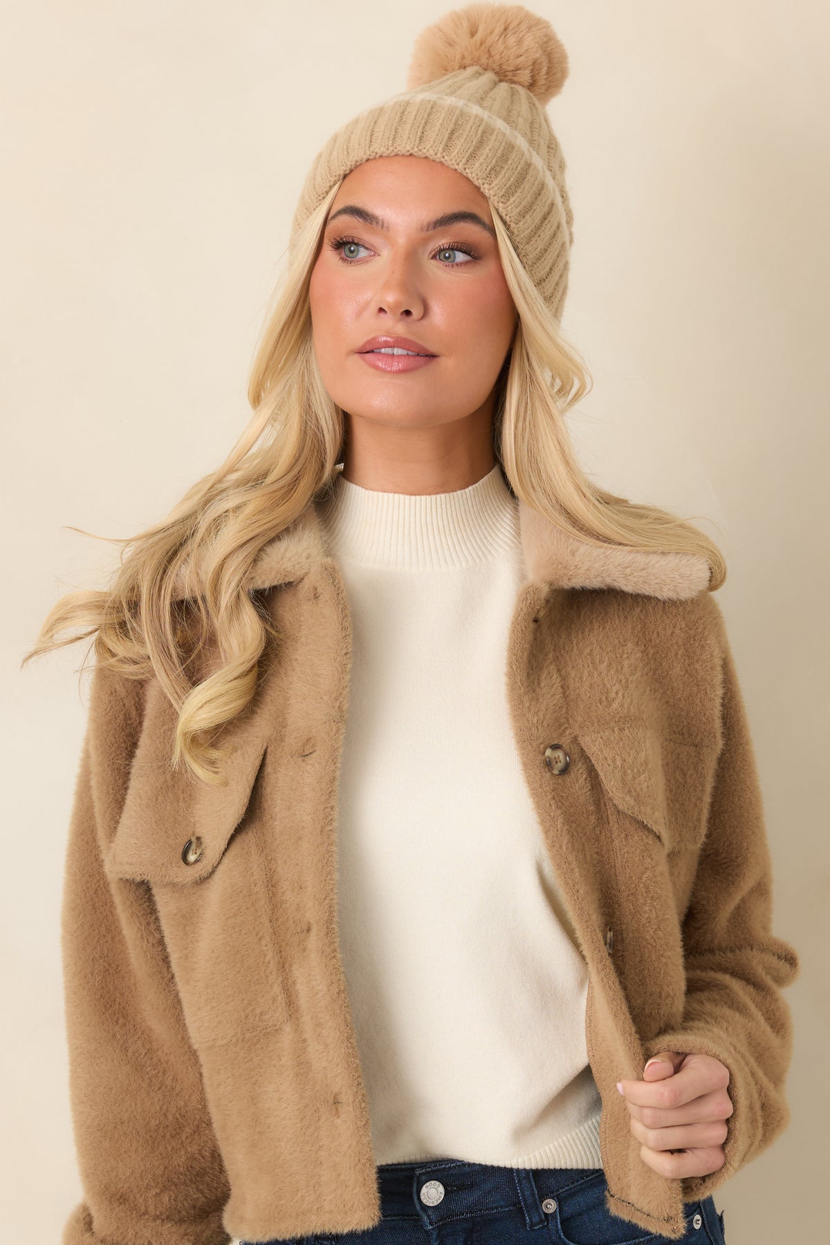 Button-front closure runs down the softly brushed camel fabric beneath the faux fur collar.