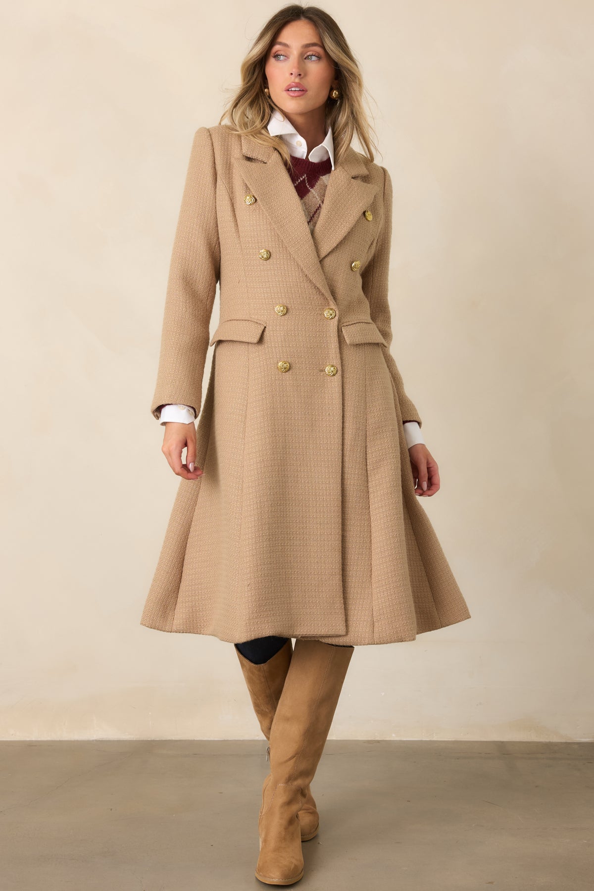 A longer tailored silhouette gives this camel topcoat a polished finish with flap pockets and buttoned cuffs.