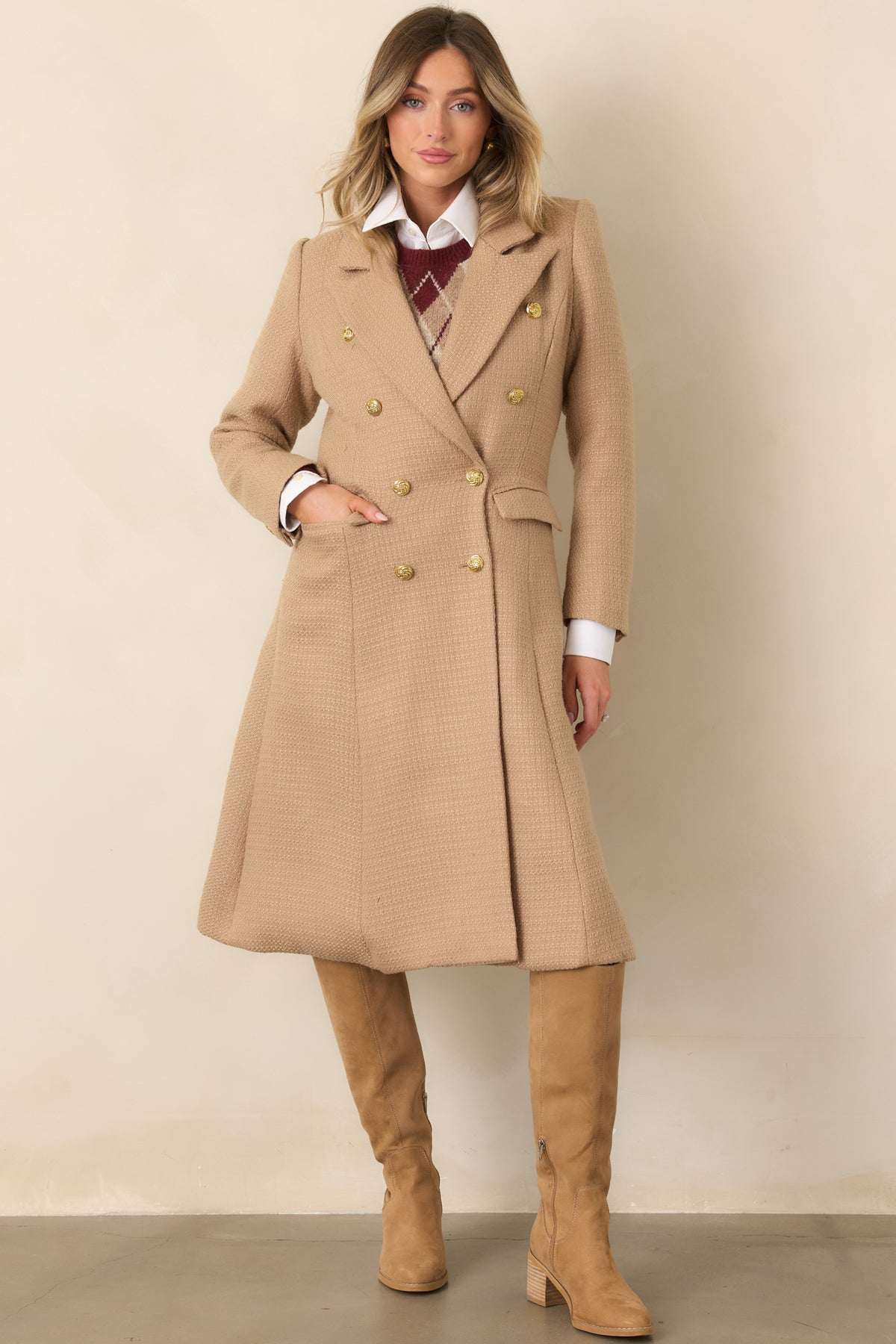 Notched lapels frame the structured front of this warm camel coat with gold-tone button detailing.