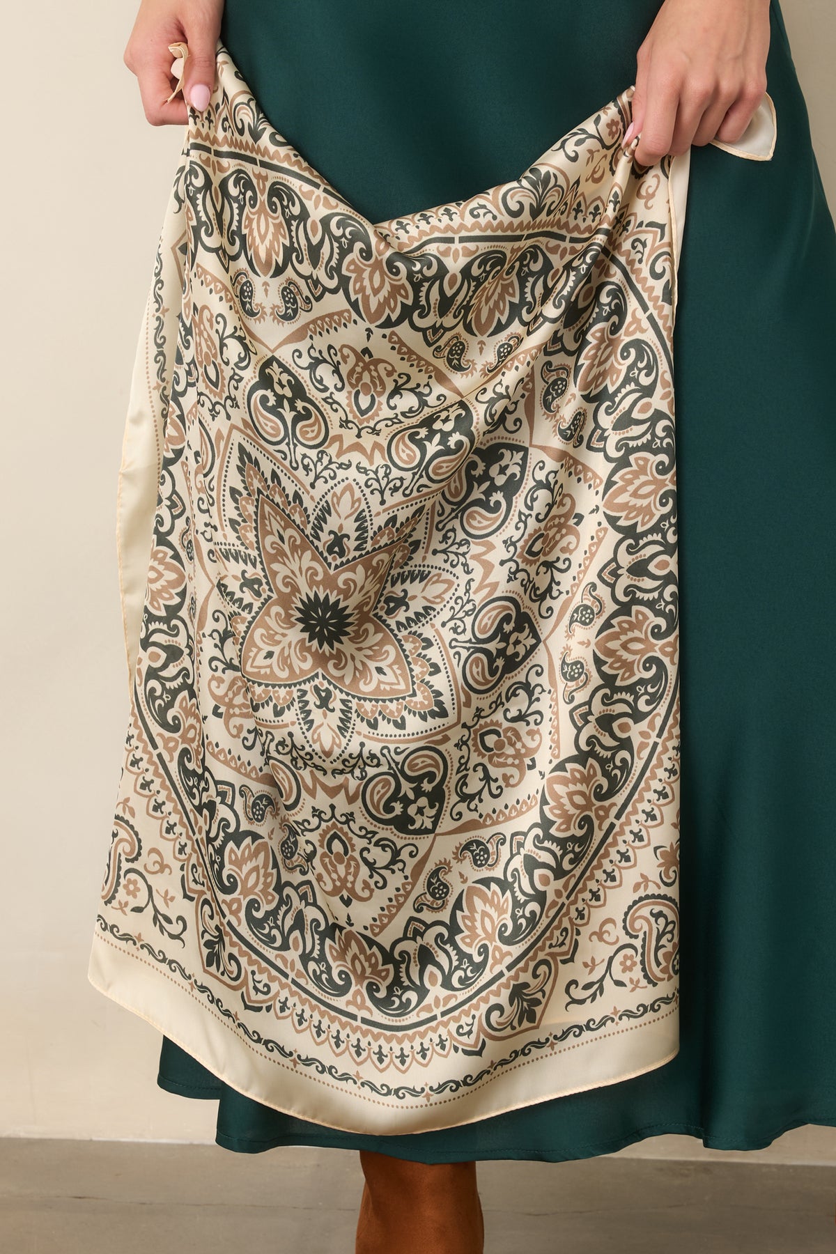 Hair scarf showcasing camel and deep olive paisley shapes, floral medallions, and intricate scrolling details against an ivory background.