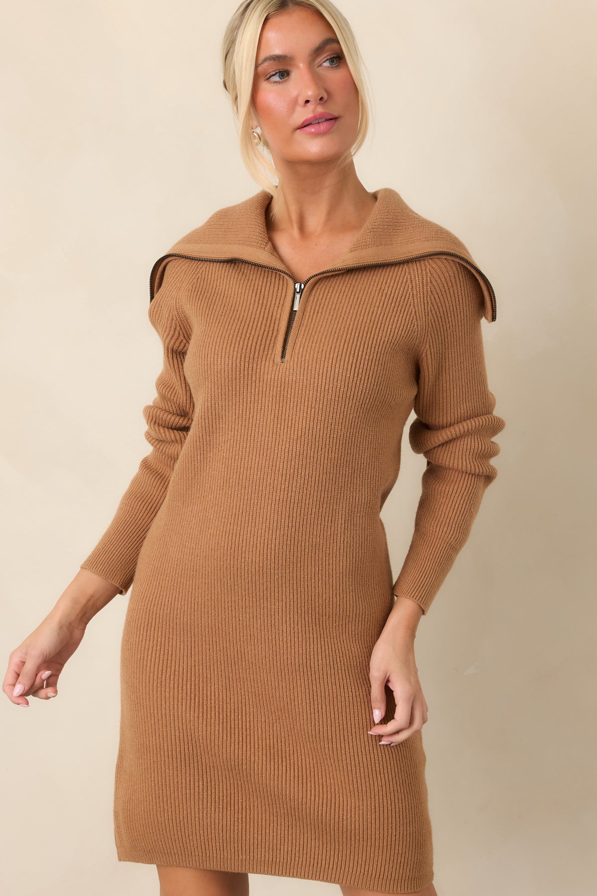 Camel brown dress highlighting the vertical ribbing and relaxed longline knit construction.