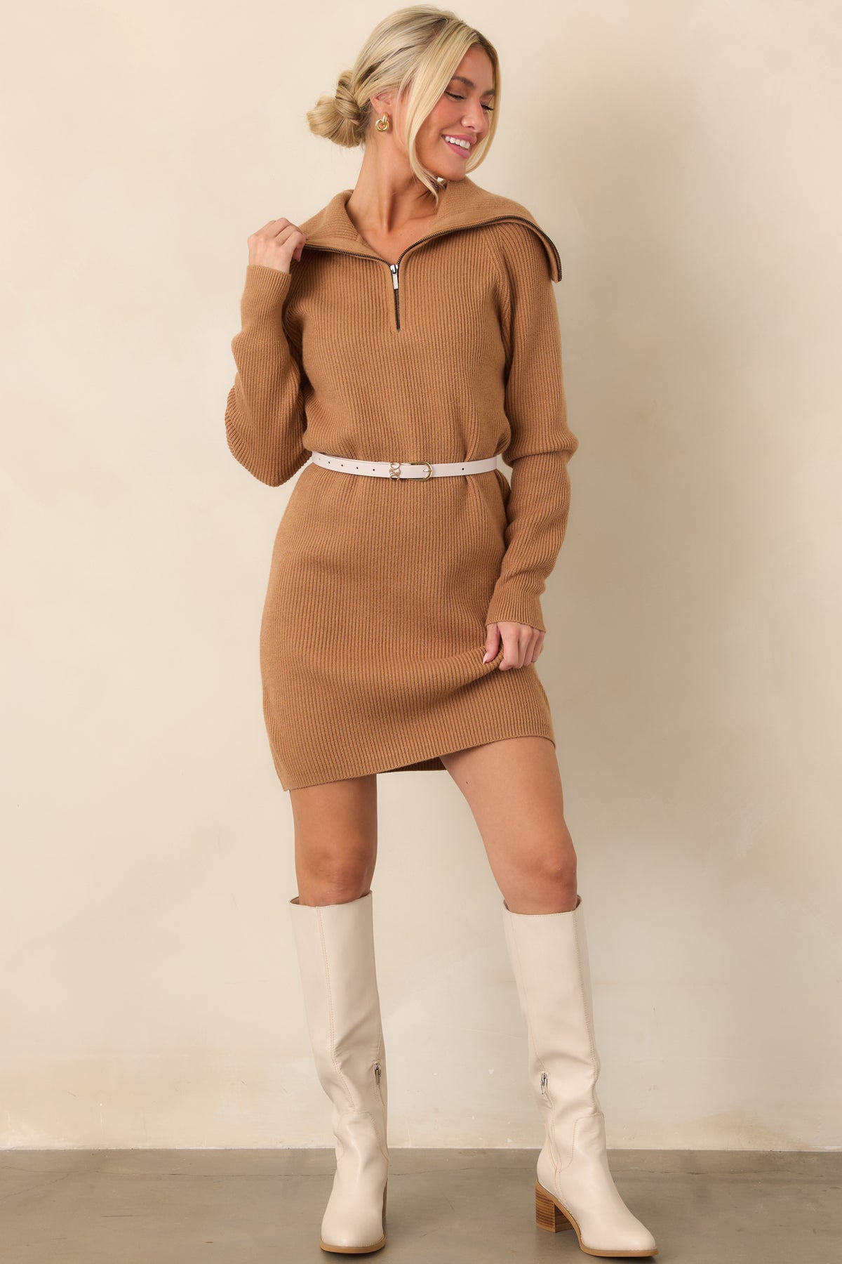 Ribbed sweater dress showcasing its funnel collar neckline, long sleeves, straight hemline, and comfortable relaxed silhouette.