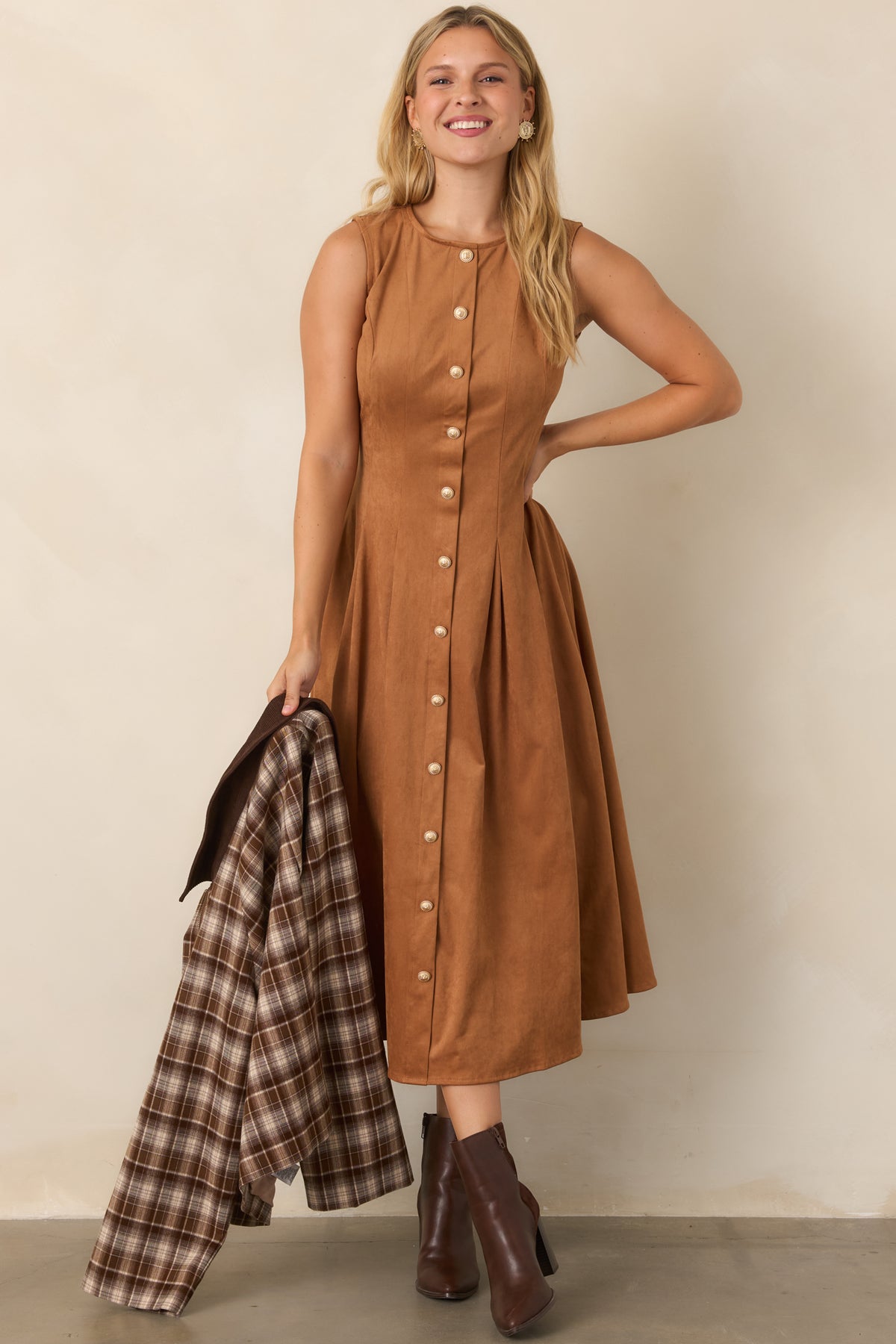 Camel sleeveless midi dress crafted from faux suede, featuring tailored princess seams, ornate gold-tone buttons, and a softly pleated skirt.
