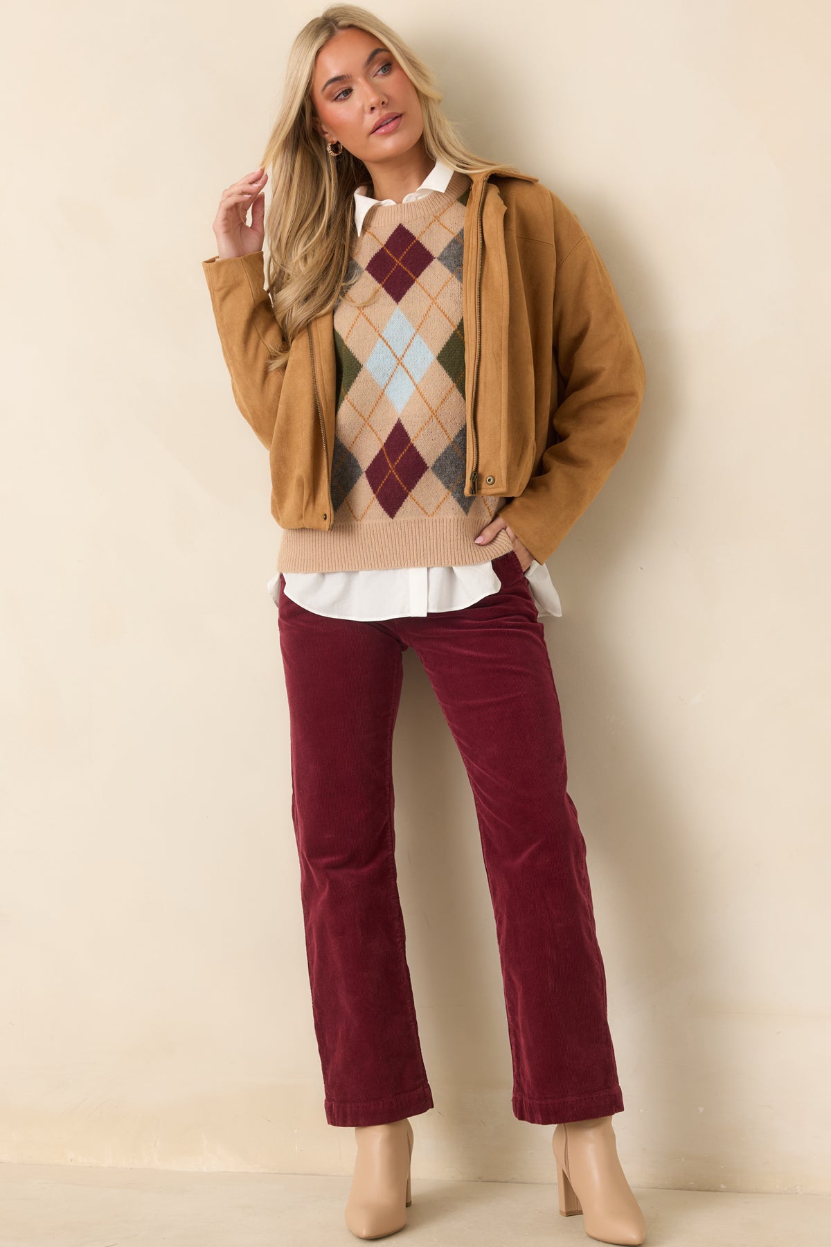 Relaxed camel sweater featuring a multicolor diamond pattern, dropped shoulders, and a classic crew neckline.