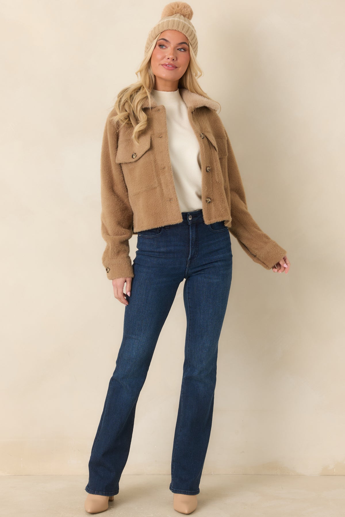 Warm camel utility jacket with long sleeves, buttoned cuffs, and front flap chest pockets.
