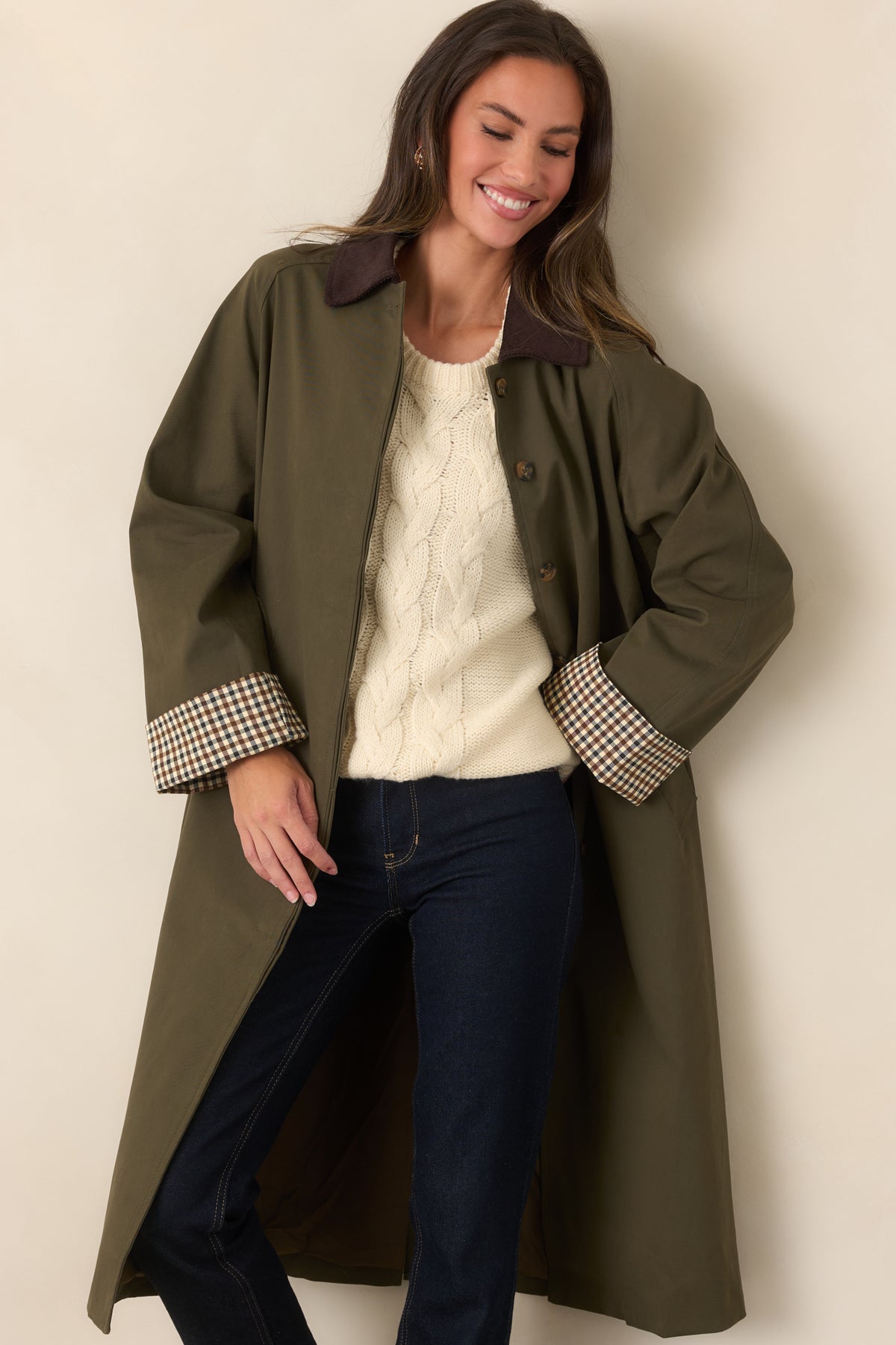 Coat with a smooth canvas-feel texture, button front, and chocolate brown corduroy collar.