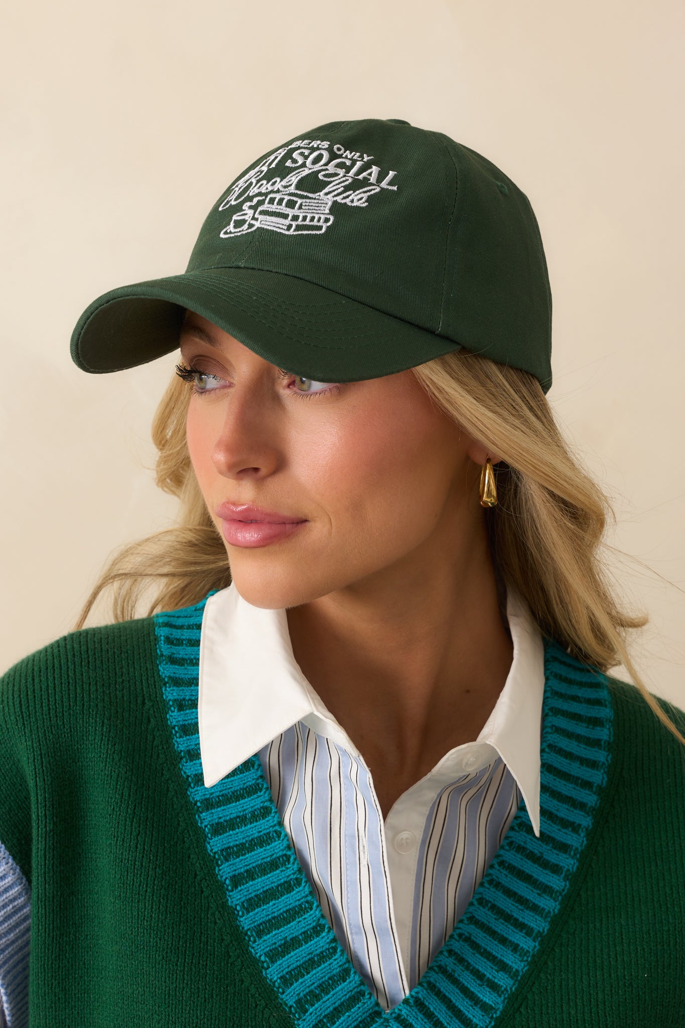 A cropped angled view showing the six-panel construction with stitched eyelets and curved brim.