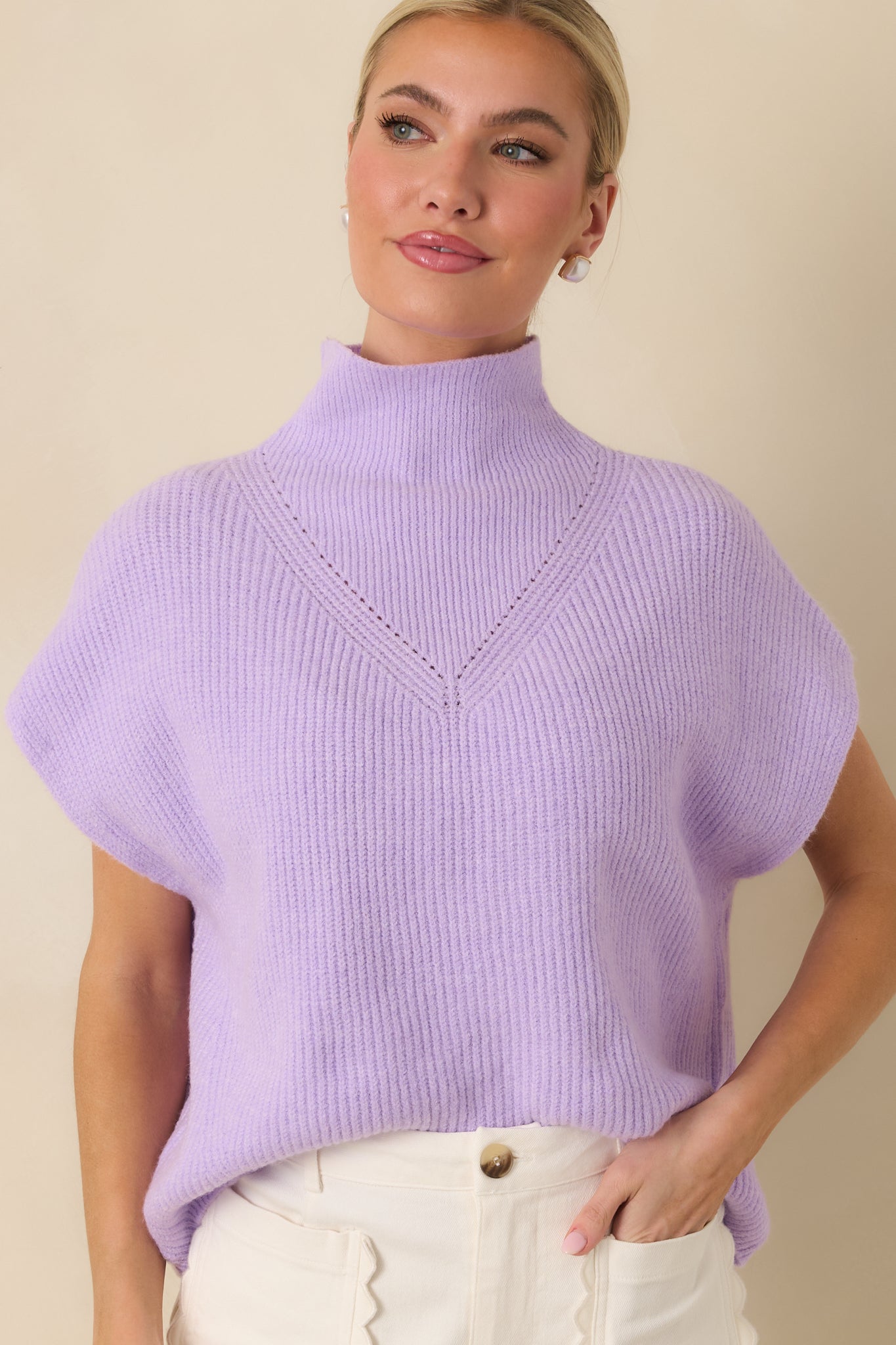 Cap sleeve and ribbed texture of the lavender sleeveless sweater.