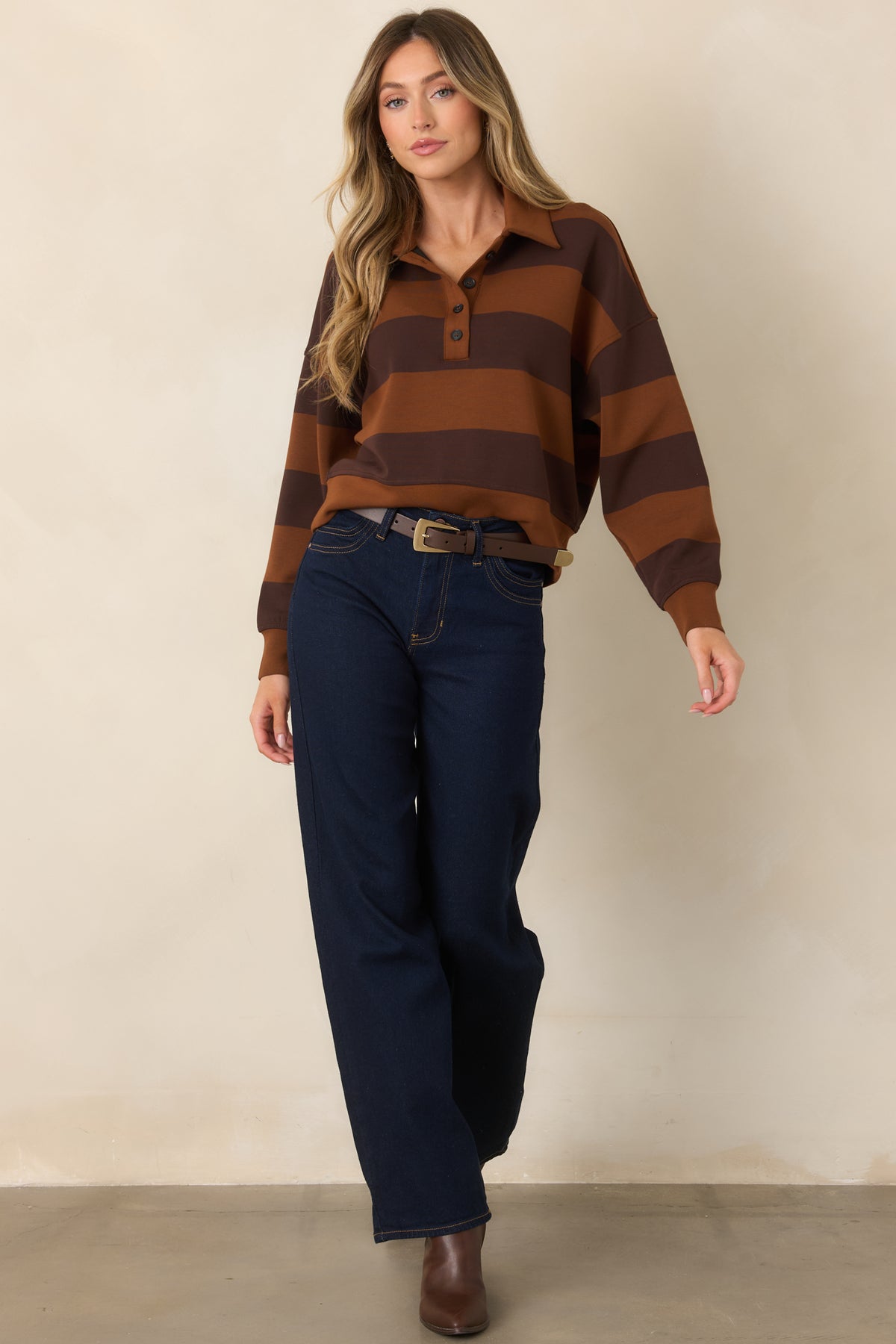 Warm caramel and deep brown top with wide stripes, a classic collar, and long sleeves with banded cuffs.