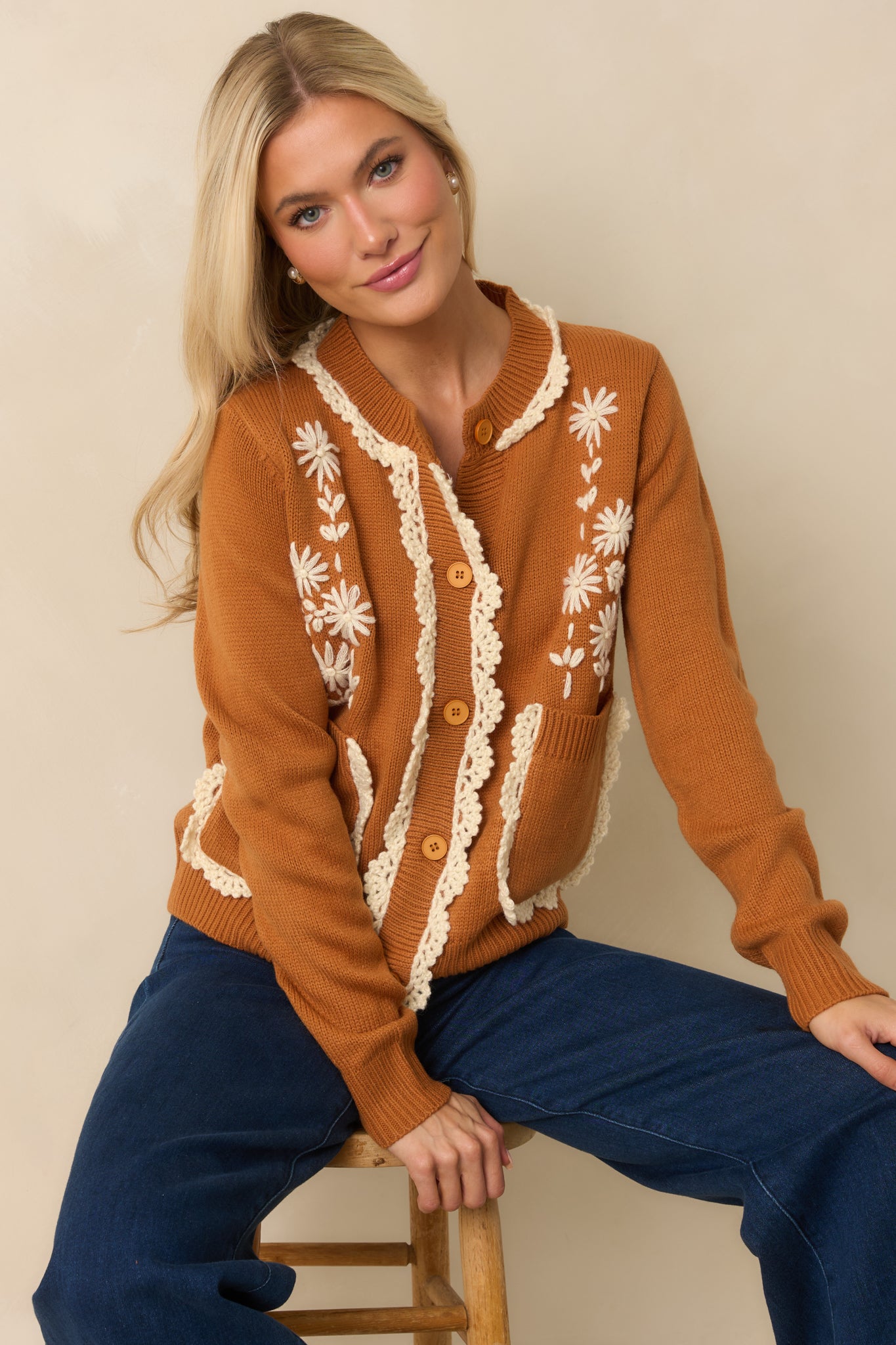 A cropped front view focusing on the scalloped crochet trim along the placket and neckline.