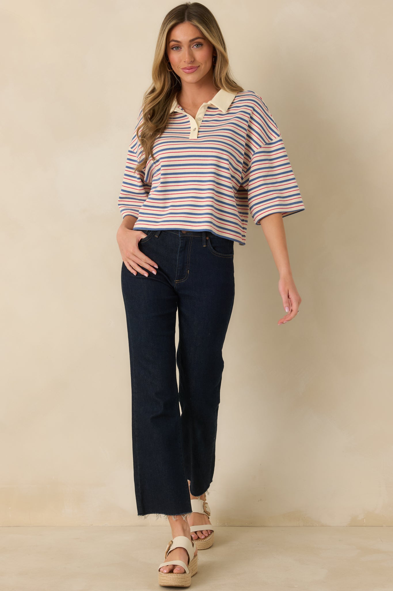 Casual striped top with cropped fit, relaxed shape, and classic polo-style neckline.