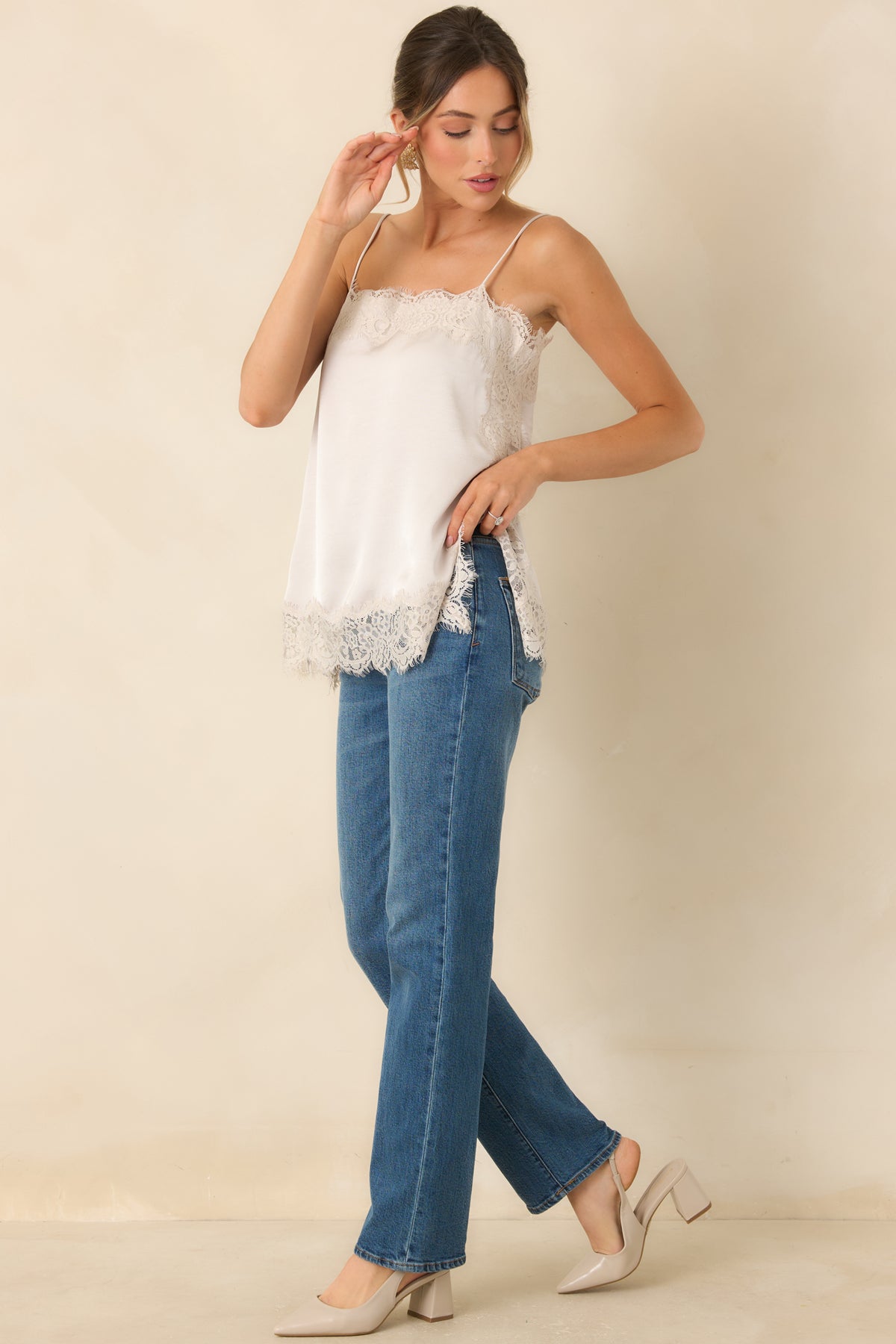 Pearly champagne satin camisole with delicate lace trim, adjustable spaghetti straps, and a relaxed silhouette.