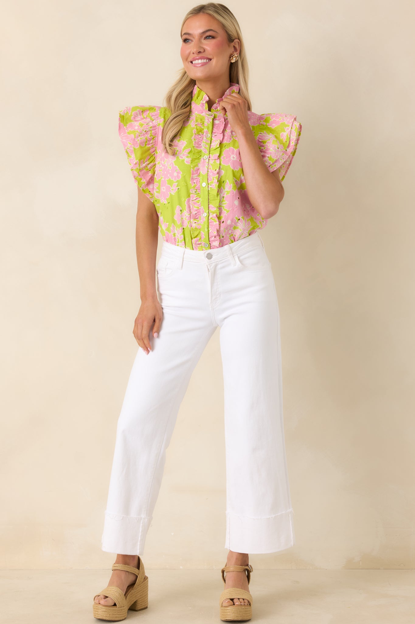 Chartreuse and pink floral top with eyelet embroidery and ruffle neckline.