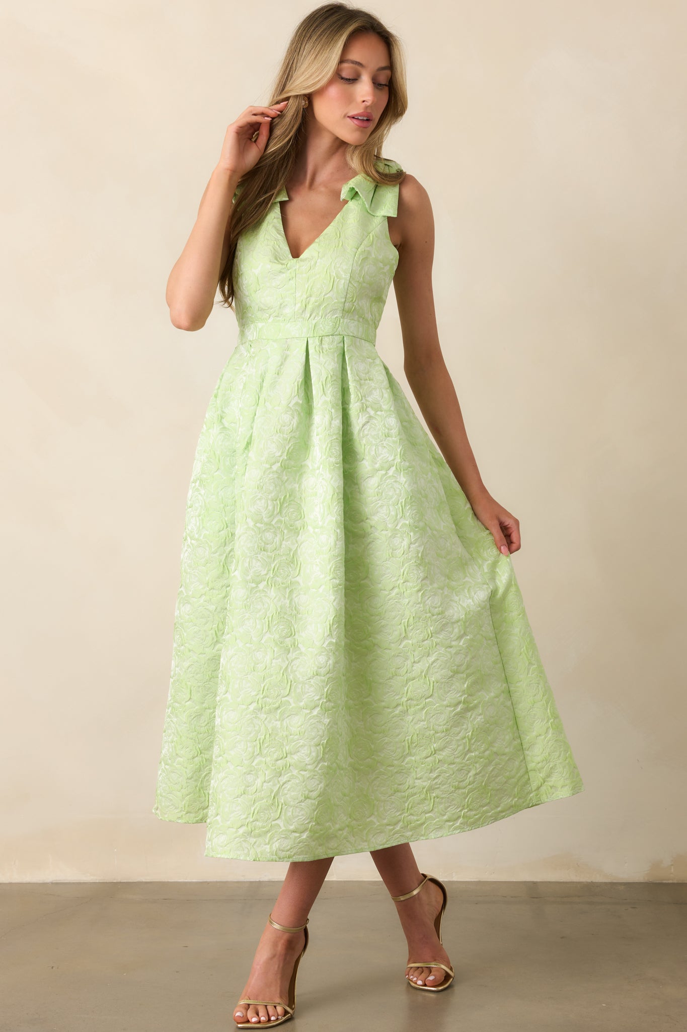 Side view of the chartreuse dress highlighting the self-tie bow straps and the clean, minimalistic fit of the silhouette.
