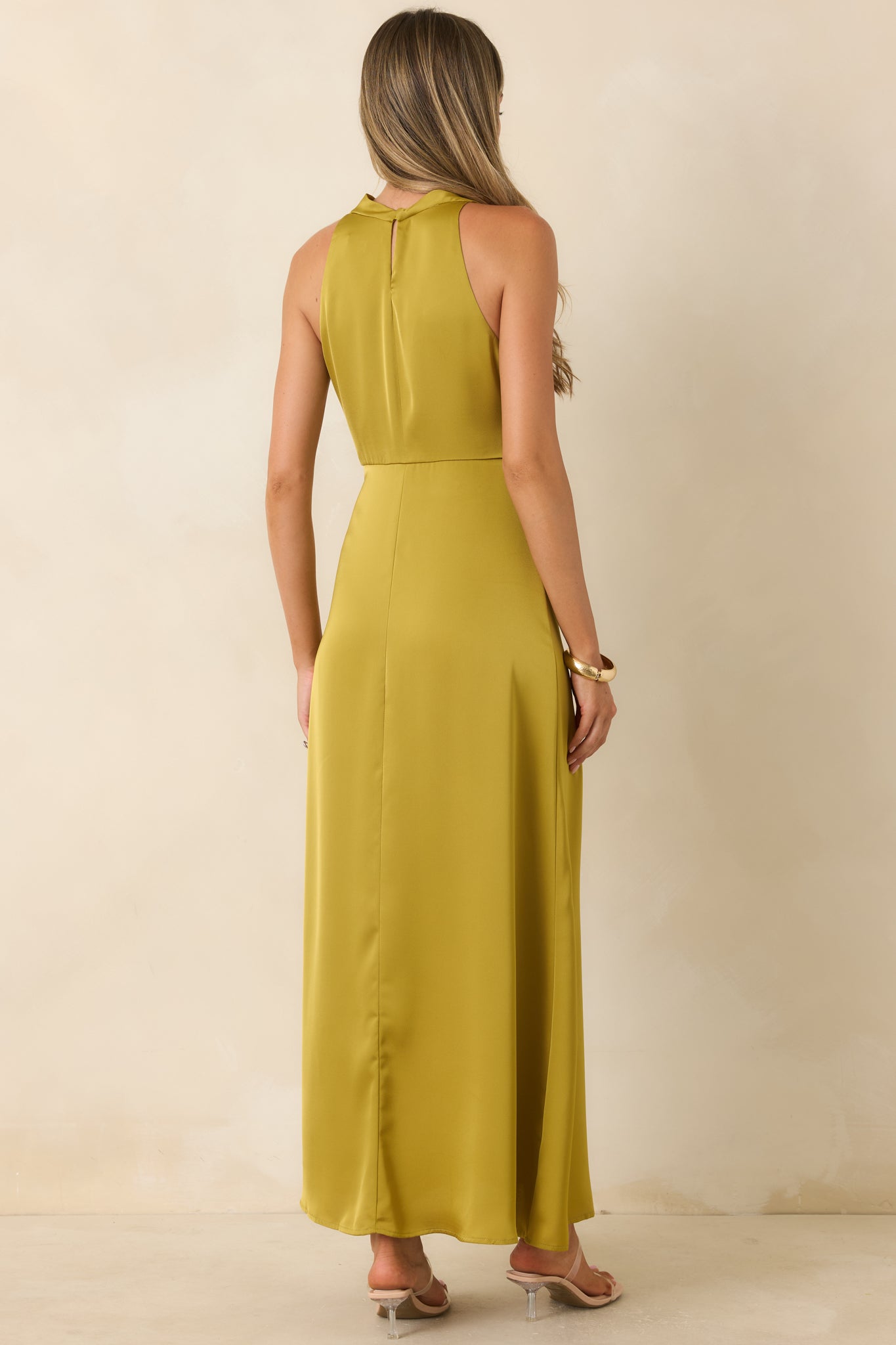 Back of the chartreuse satin maxi dress featuring a keyhole closure with a single button detail.