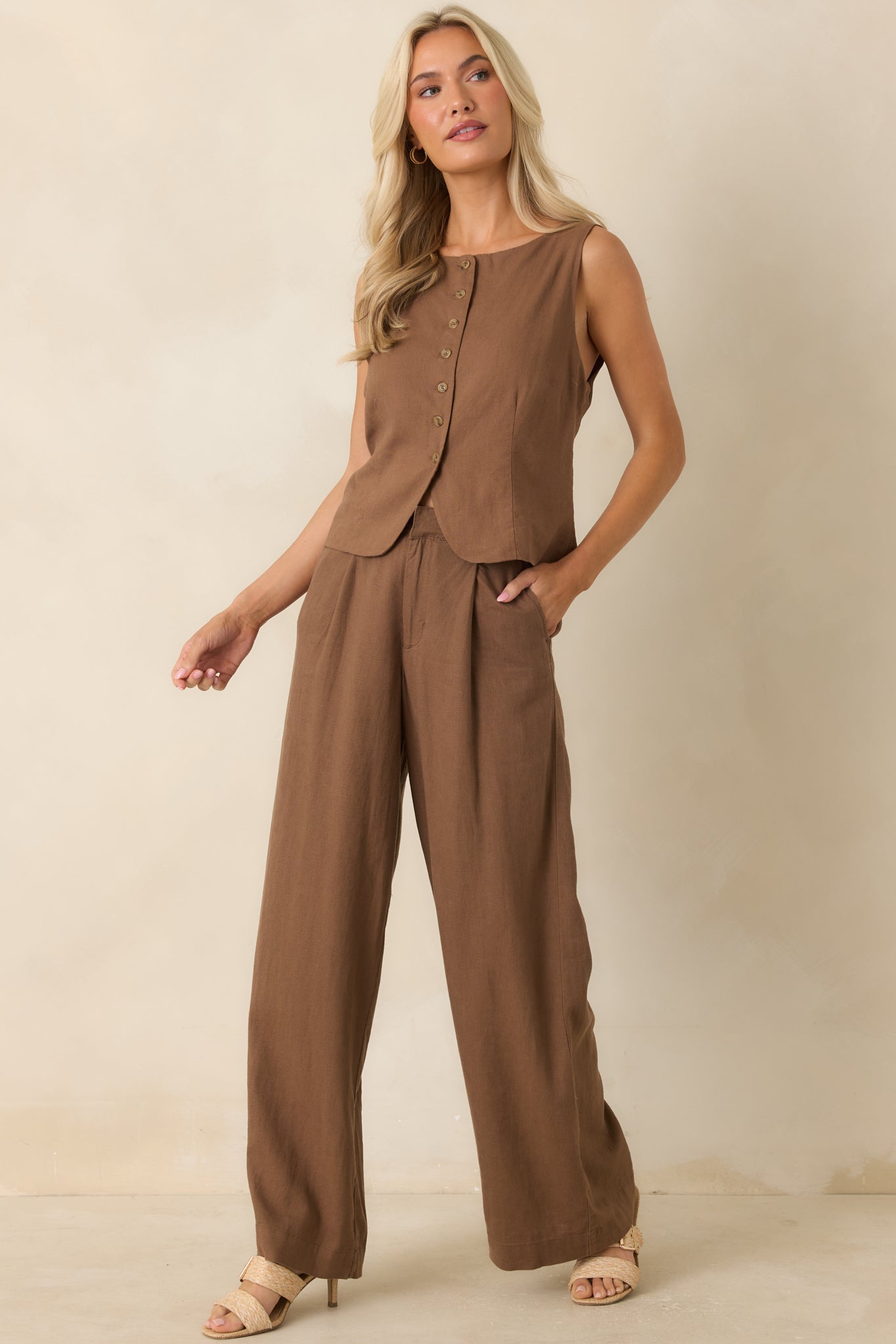 Chestnut brown full-length pants featuring a high-rise fit, straight-leg silhouette, and tailored design.