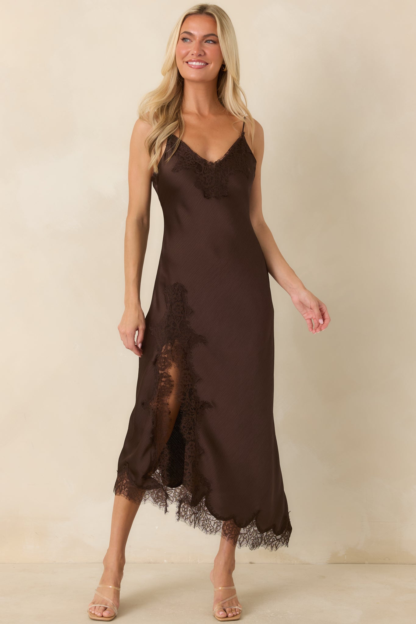 Chocolate satin midi dress with adjustable straps, a bias-cut shape, and elegant lace detailing throughout.