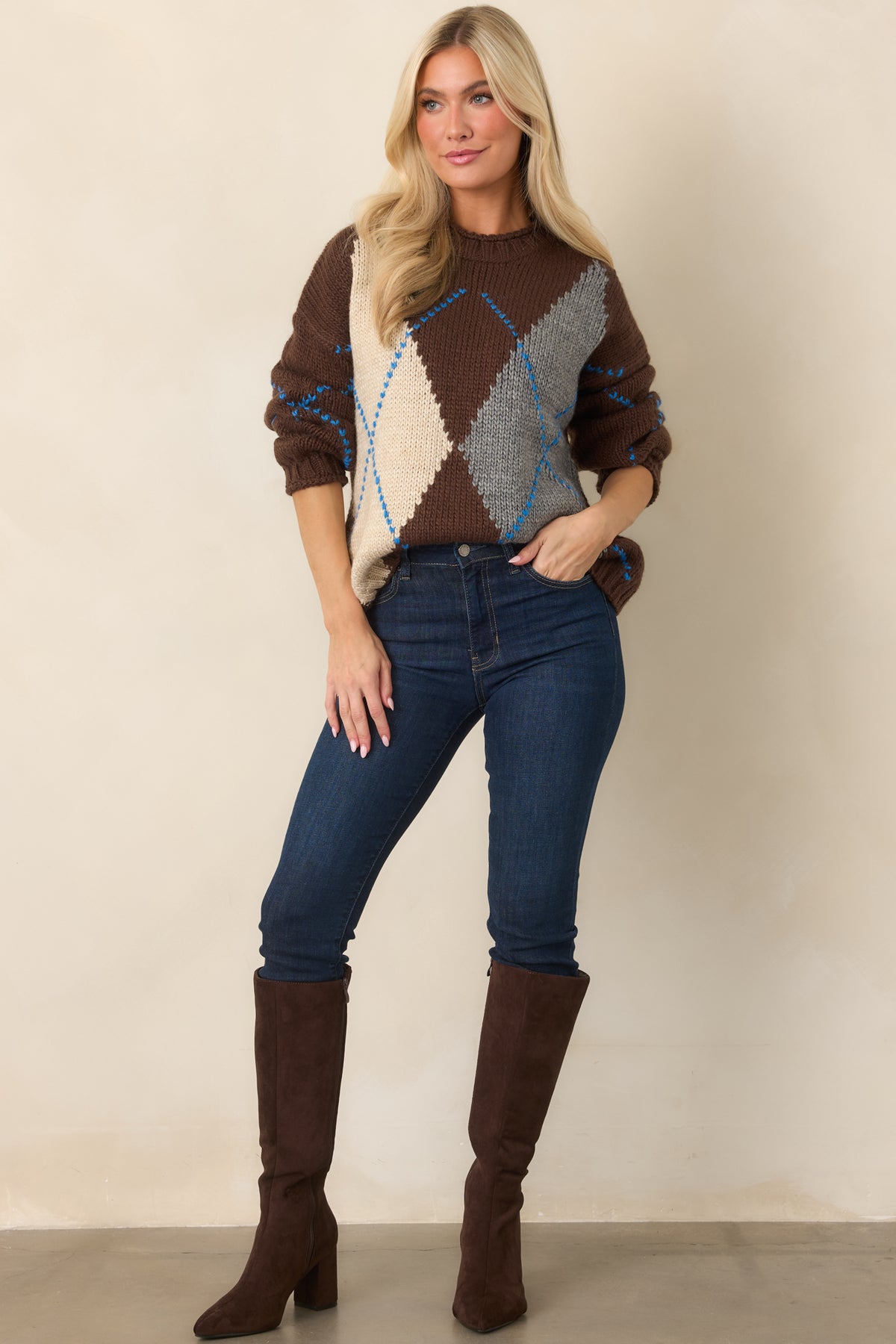 Chocolate brown chunky knit sweater featuring bold ivory and heather gray diamonds, a crew neckline, and relaxed silhouette.