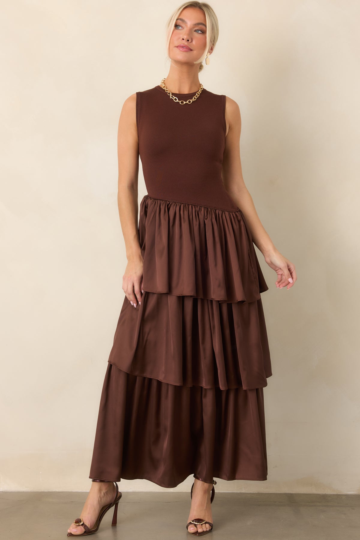 Chocolate brown dress features contrasting knit and woven textures joined by a softly angled waist seam.