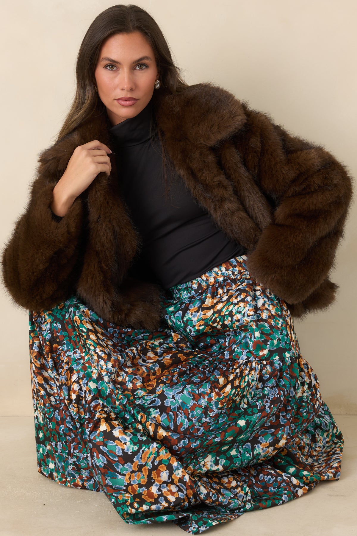 Chocolate brown faux fur jacket featuring a generous collar, long sleeves, and a relaxed silhouette.