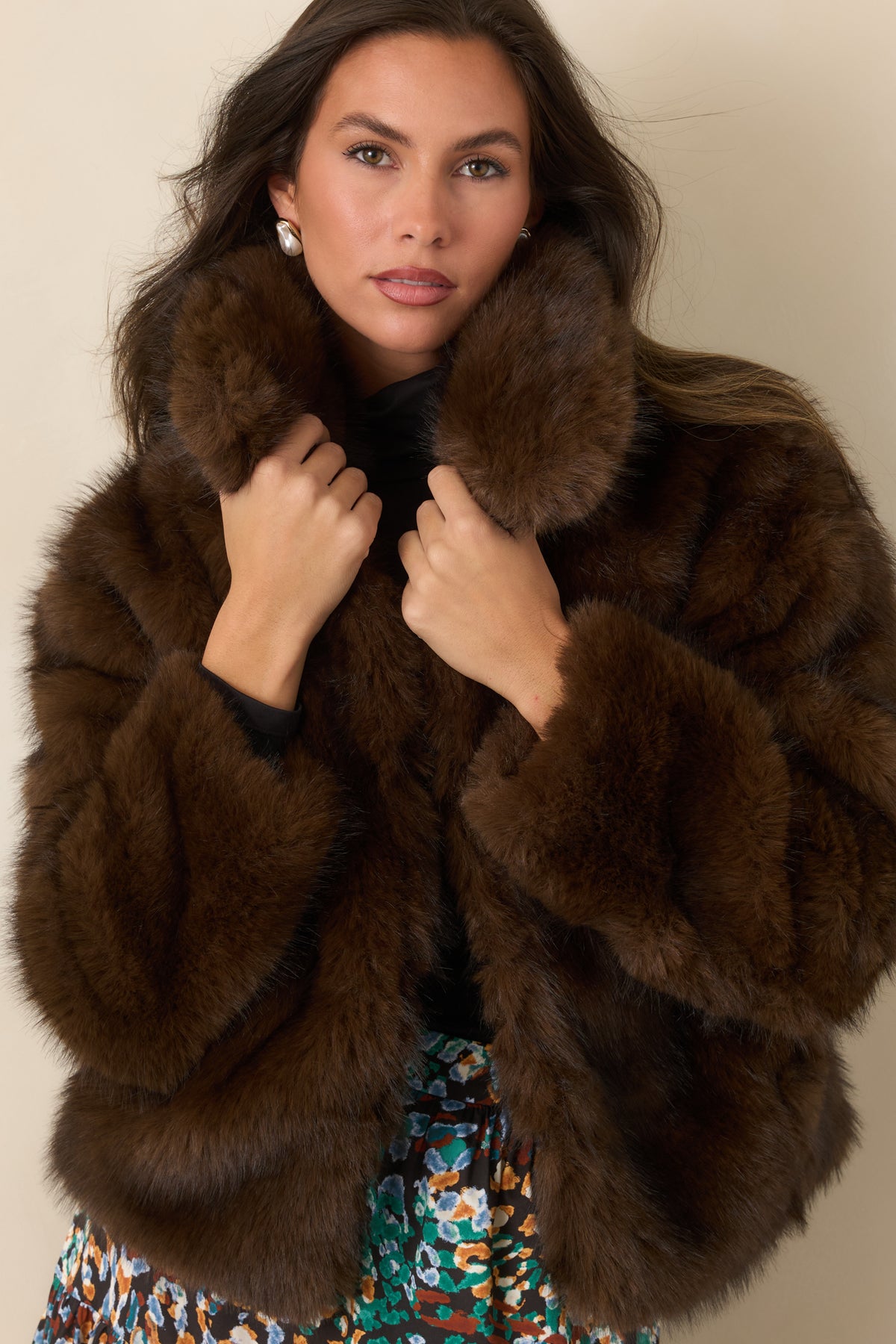 Chocolate brown faux fur jacket featuring the oversized collar and plush construction.