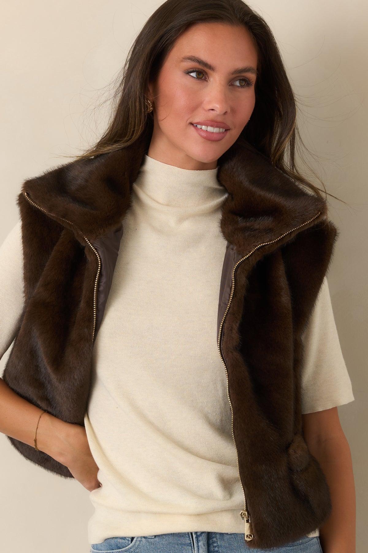 Chocolate brown faux fur vest showcasing its dense plush texture and softly structured collar.